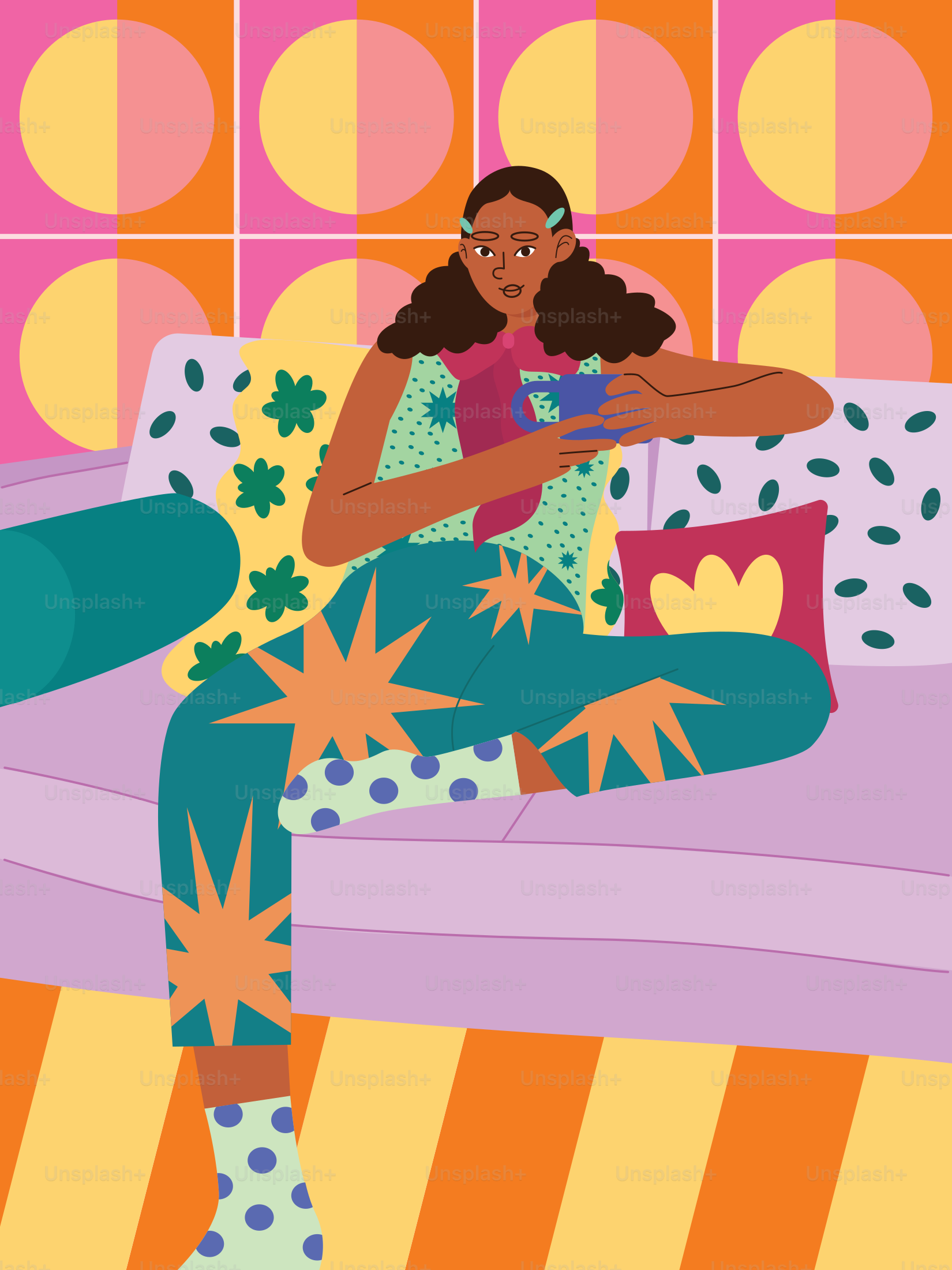 A woman sitting on top of a couch in a room