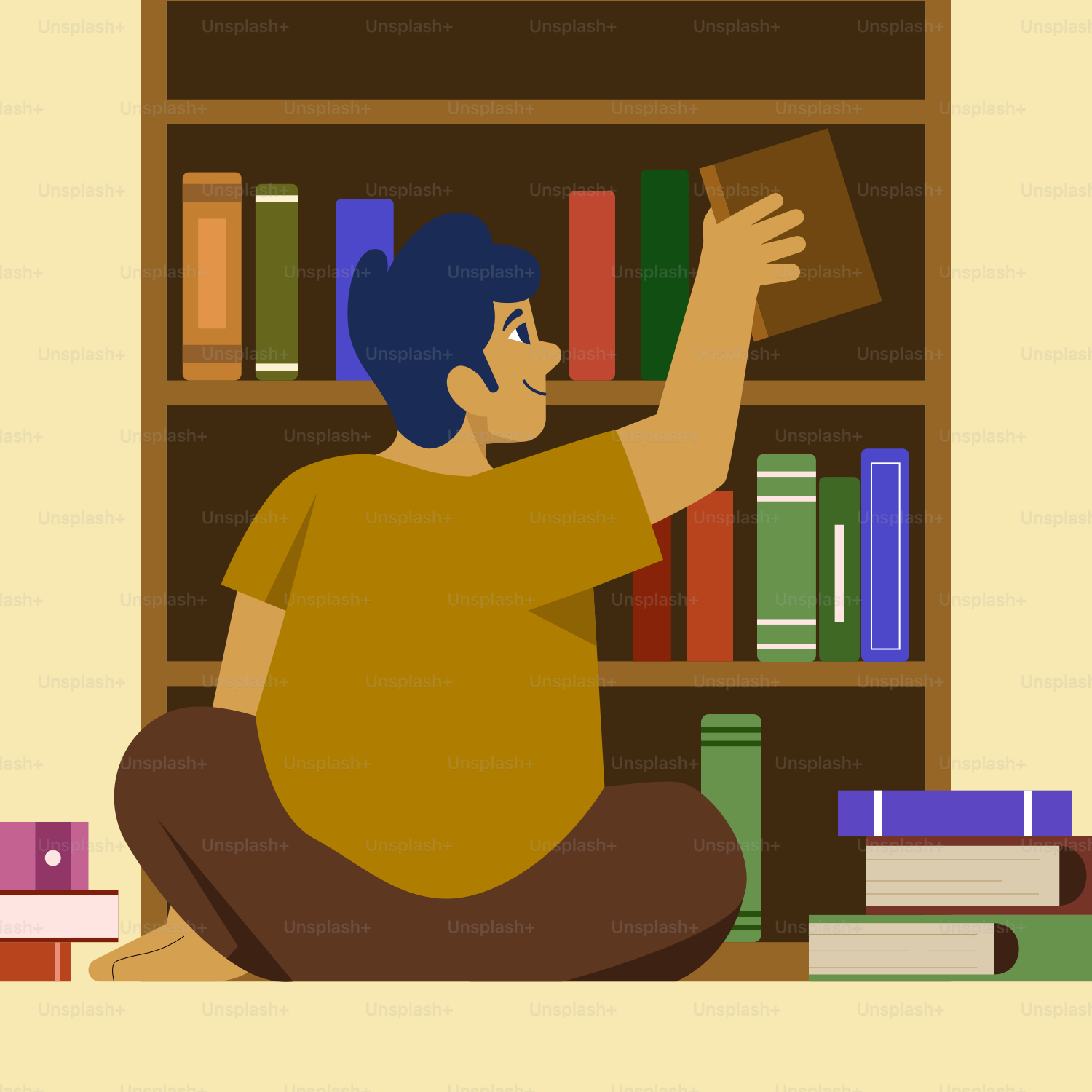A man sitting on the floor in front of a book shelf