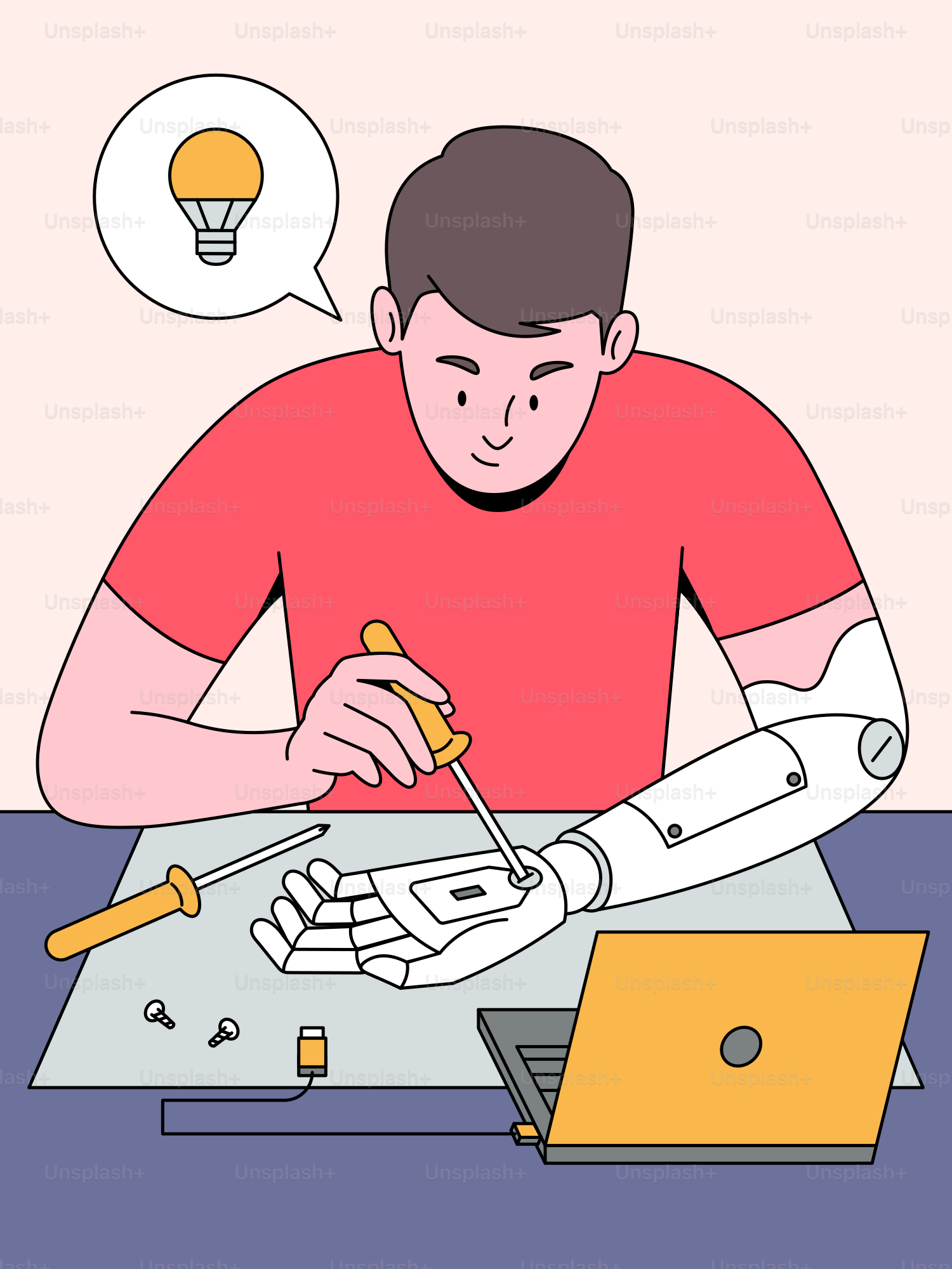 A man sitting at a table working on a robot