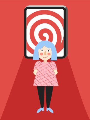 A woman standing in front of a phone with a target on the screen