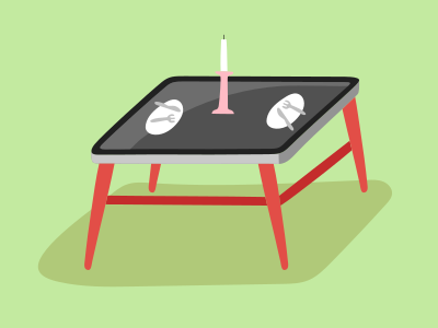 A table with a candle on top of it