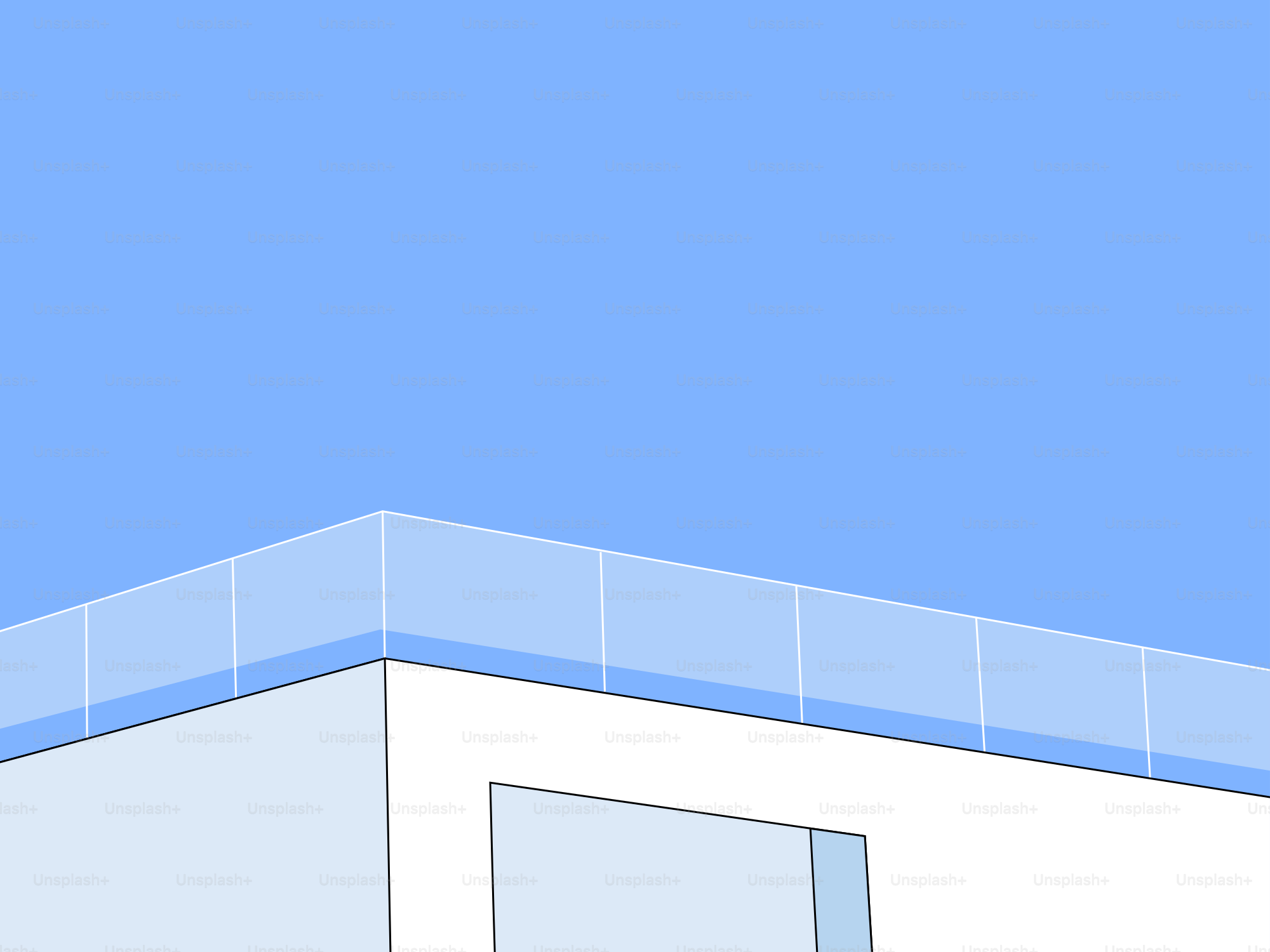 A white building with a blue sky in the background