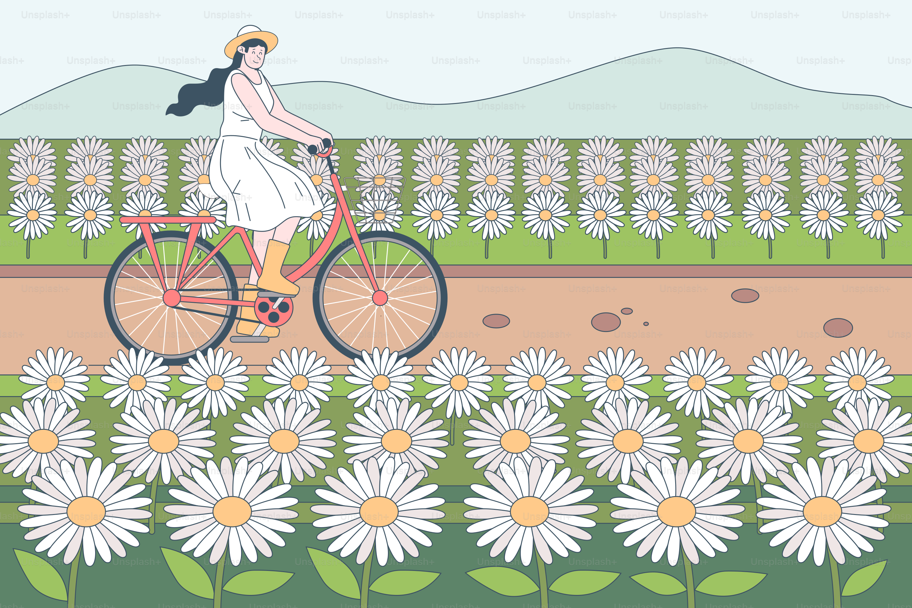 Une femme à vélo à travers un champ de fleurs