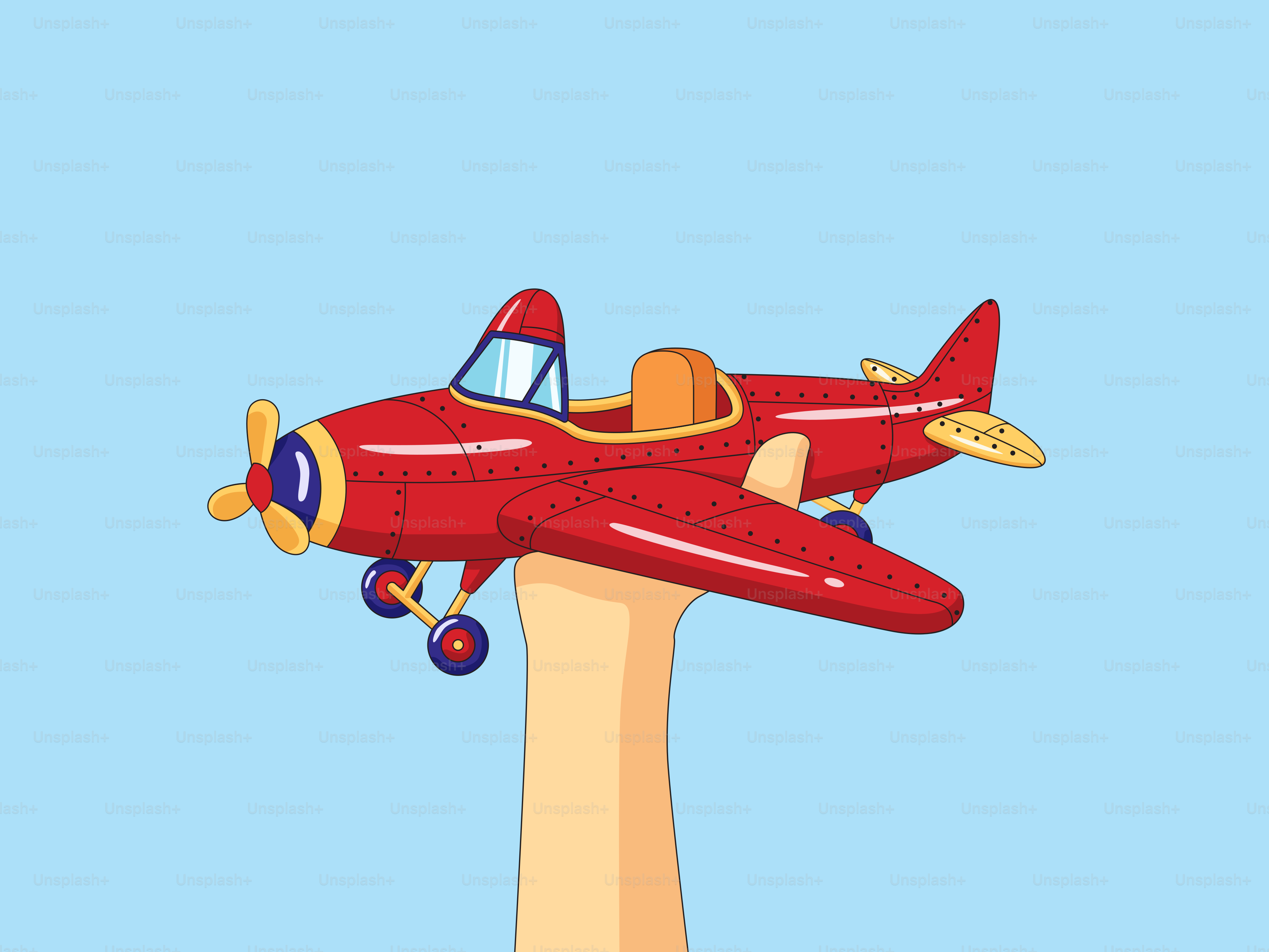 A hand holding a toy airplane in the air