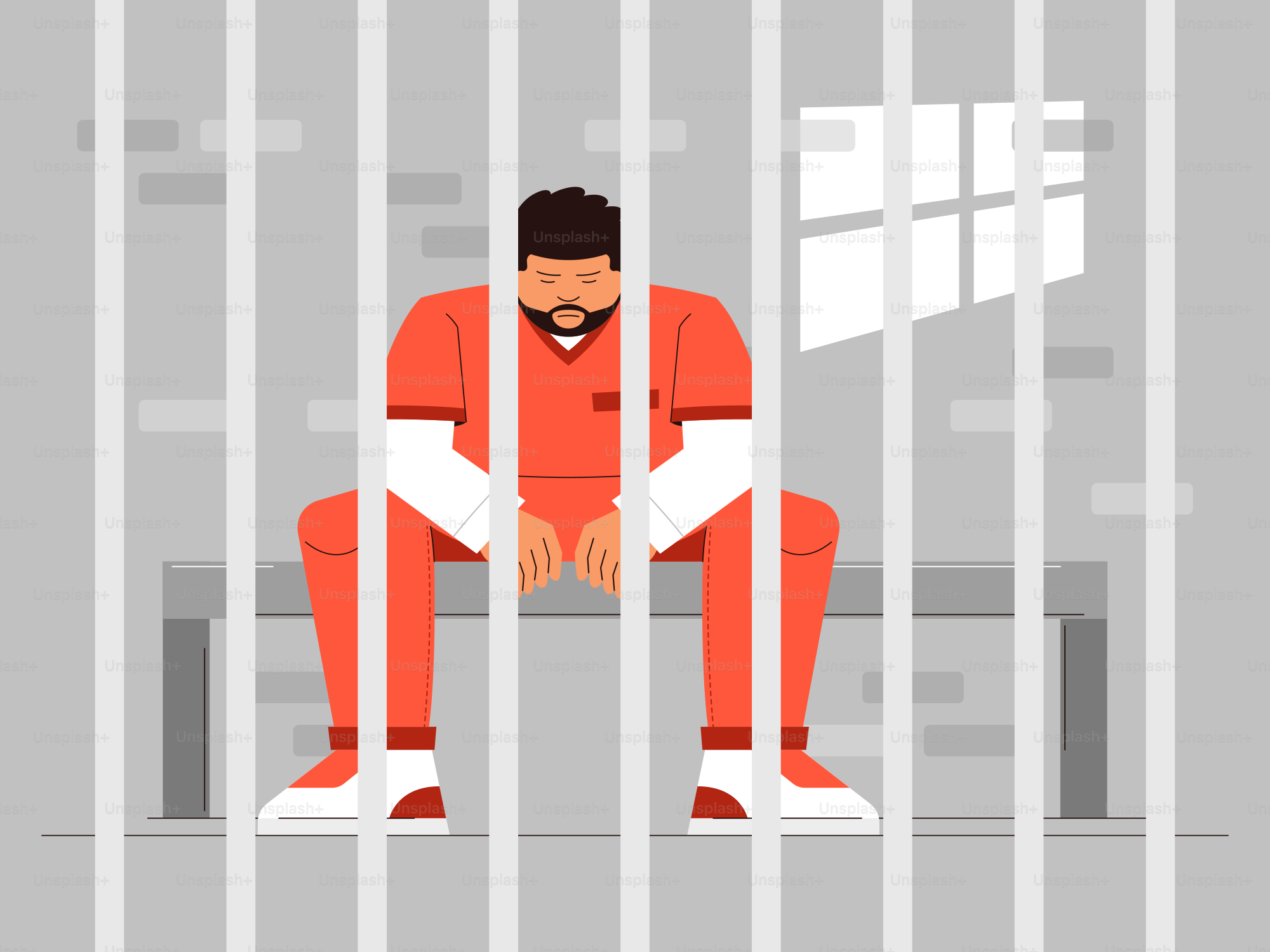 Un homme est assis dans une cellule de prison