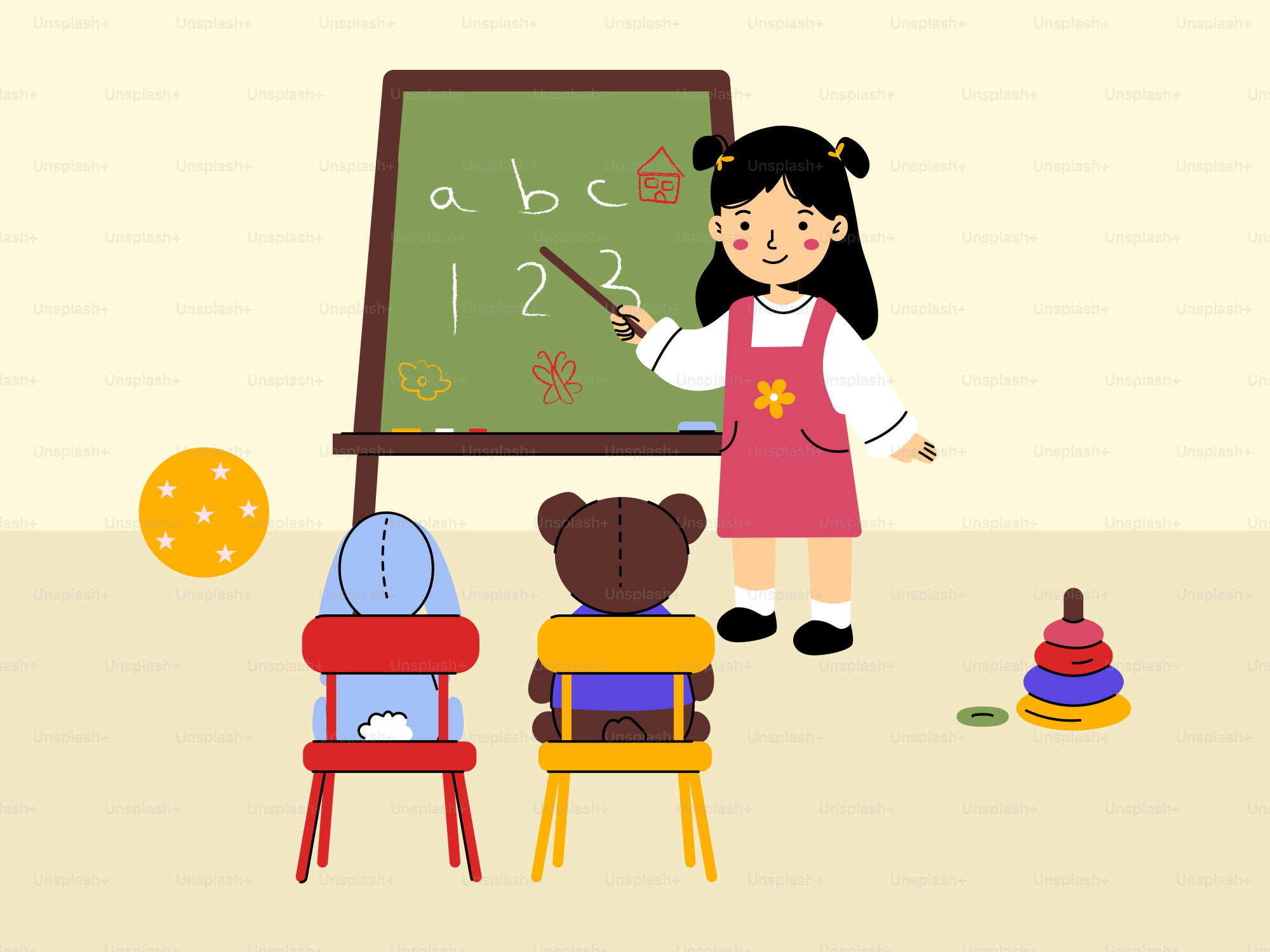 A little girl standing in front of a blackboard