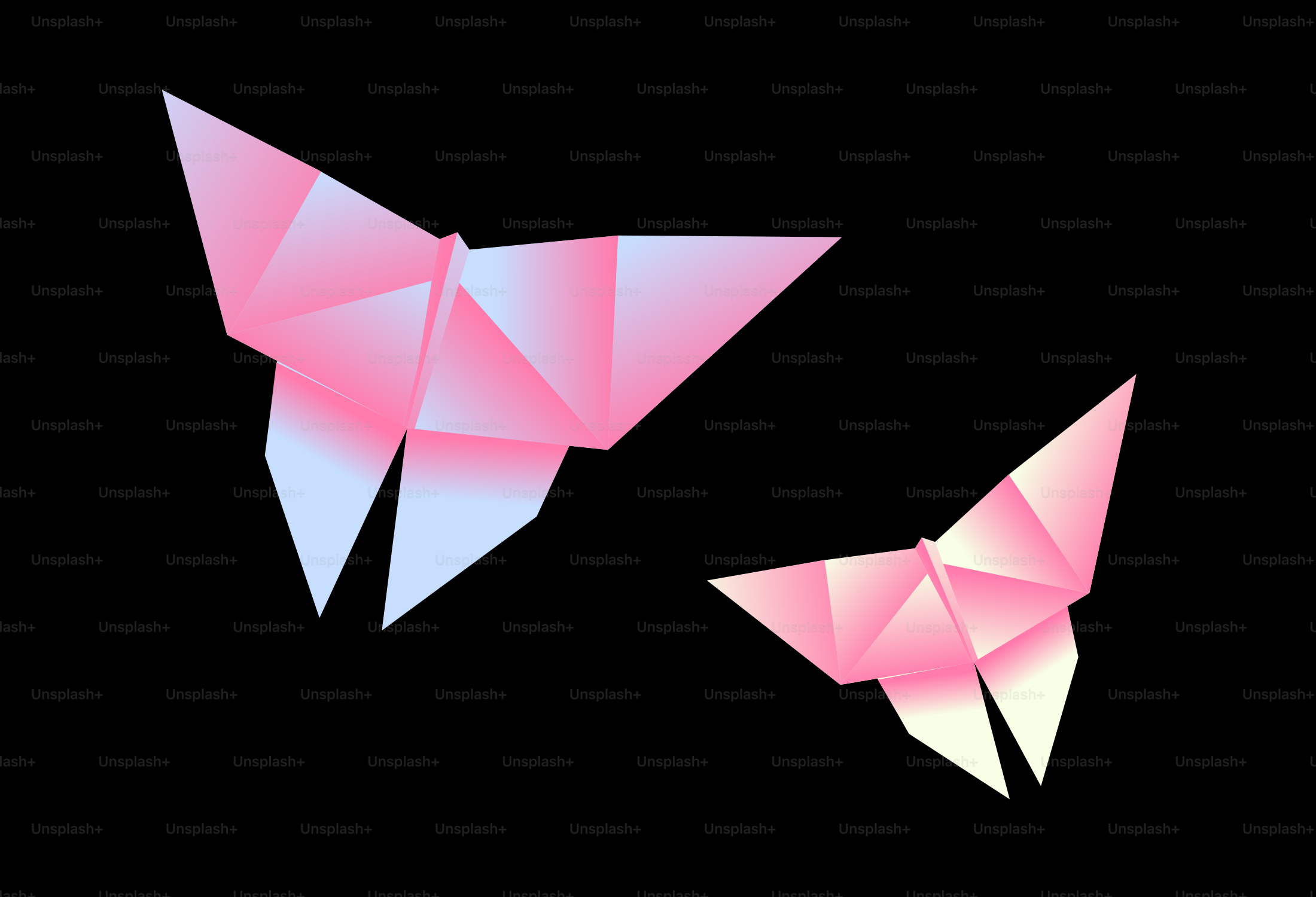 Two pink origami birds on a black background