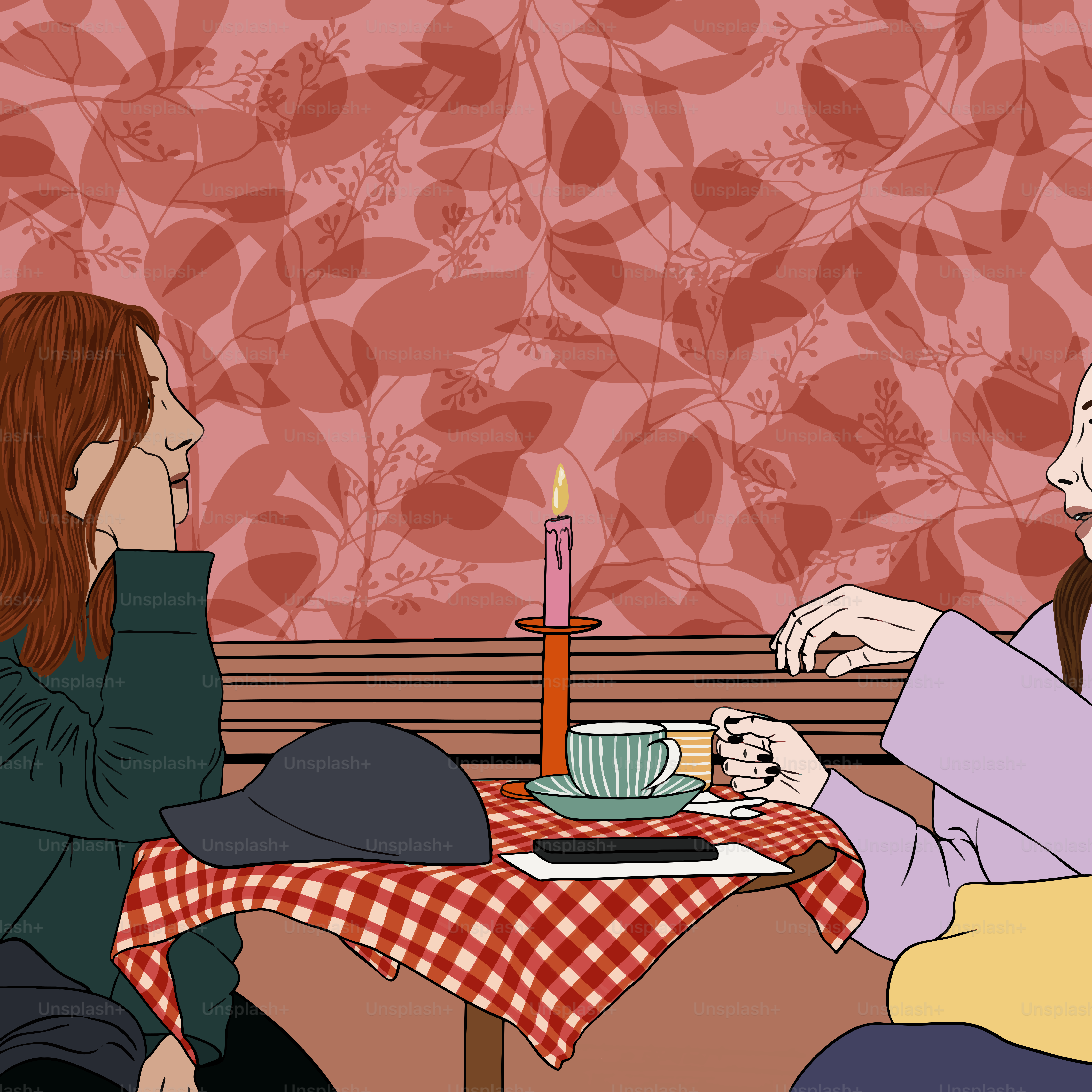 Zwei Frauen, die an einem Tisch sitzen und miteinander reden