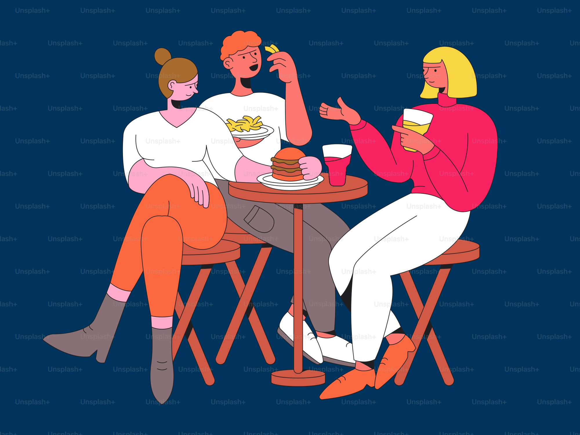 A group of people sitting around a table eating food