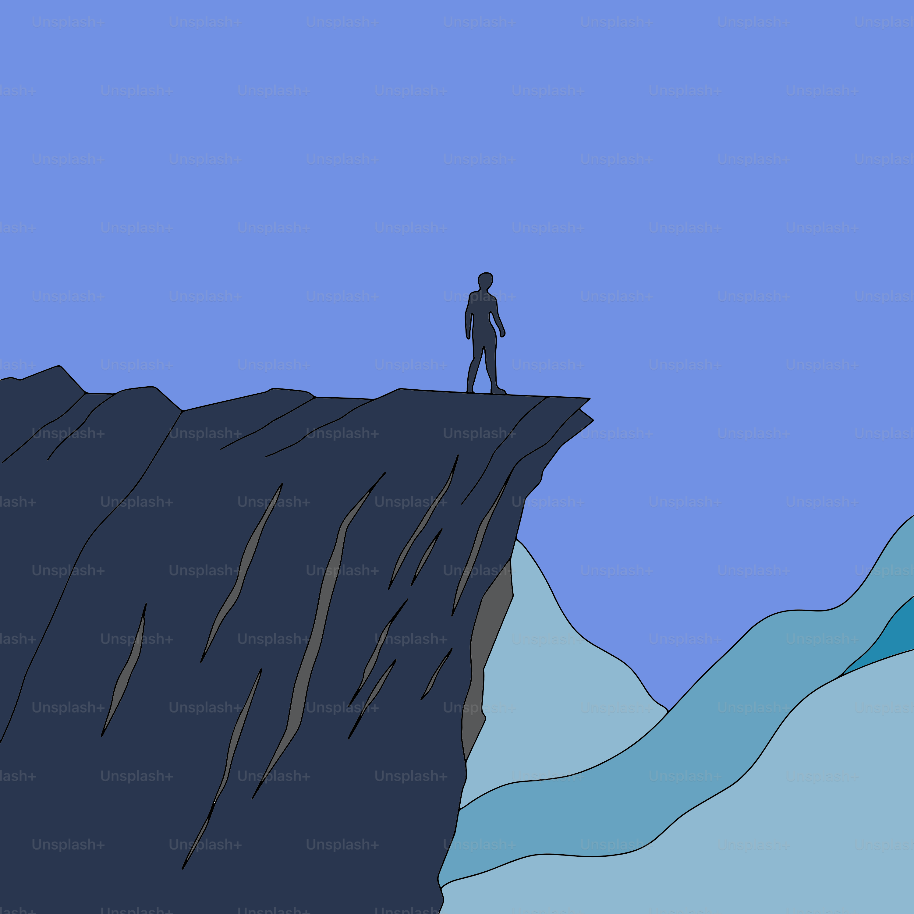 A man standing on top of a cliff
