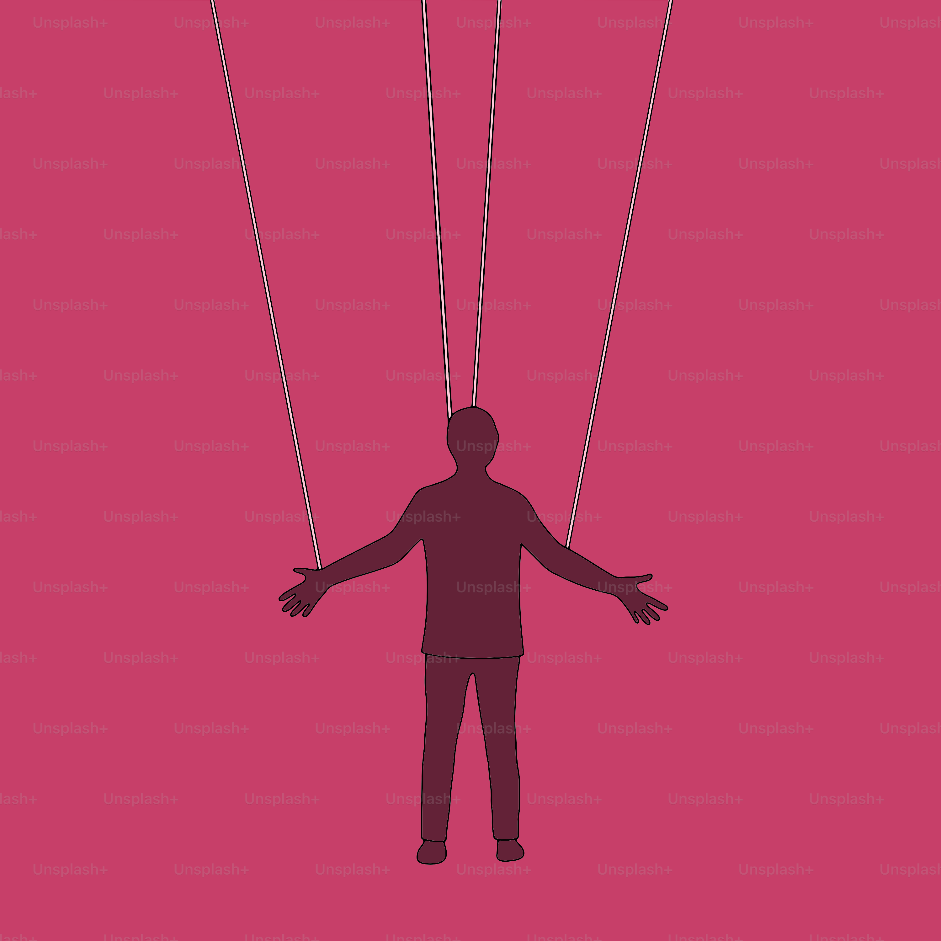 Ein Mann, der sich an einer Schnur festhält, die an einem Drachen befestigt ist