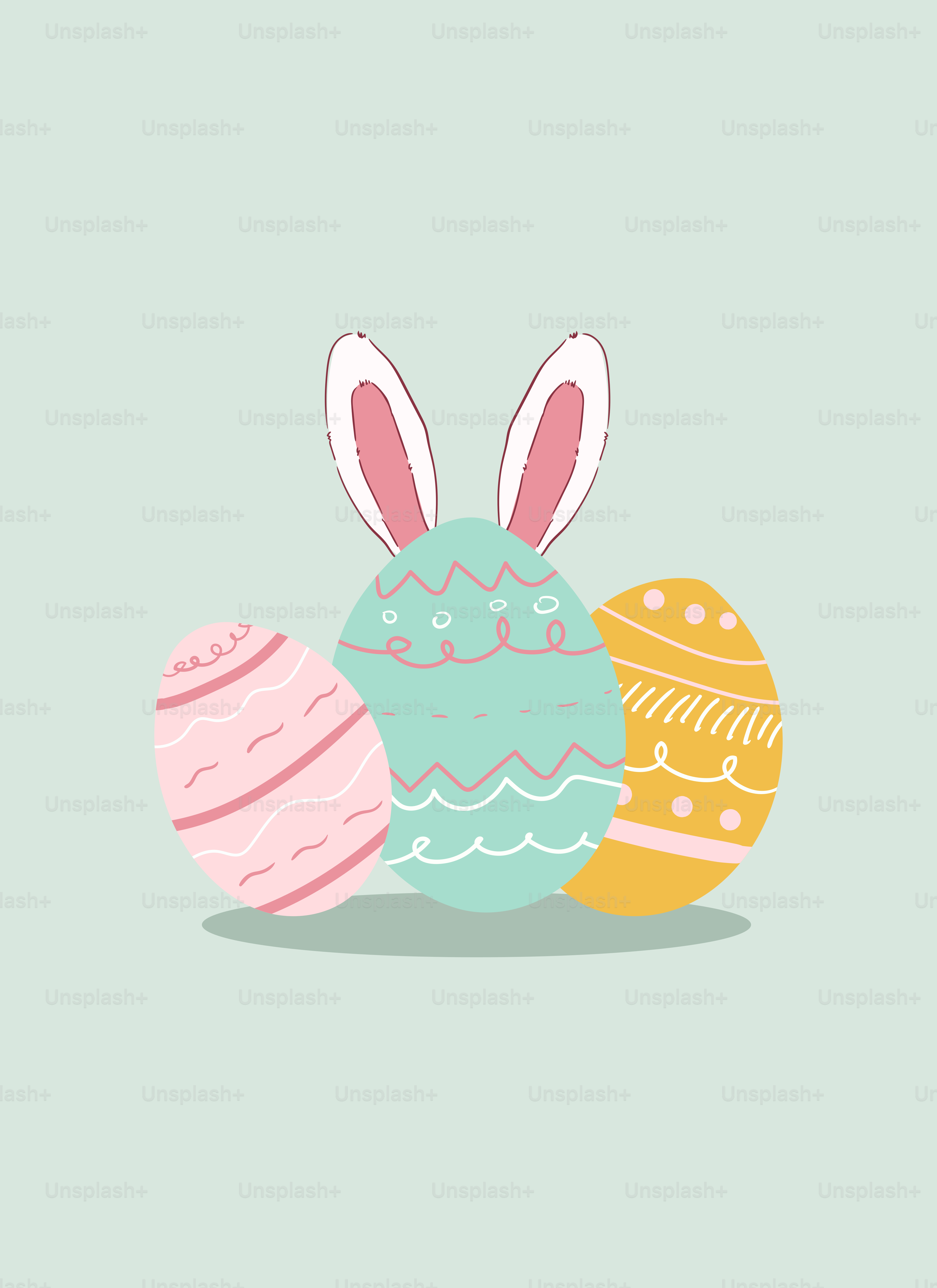 Tres huevos de Pascua con orejas de conejo