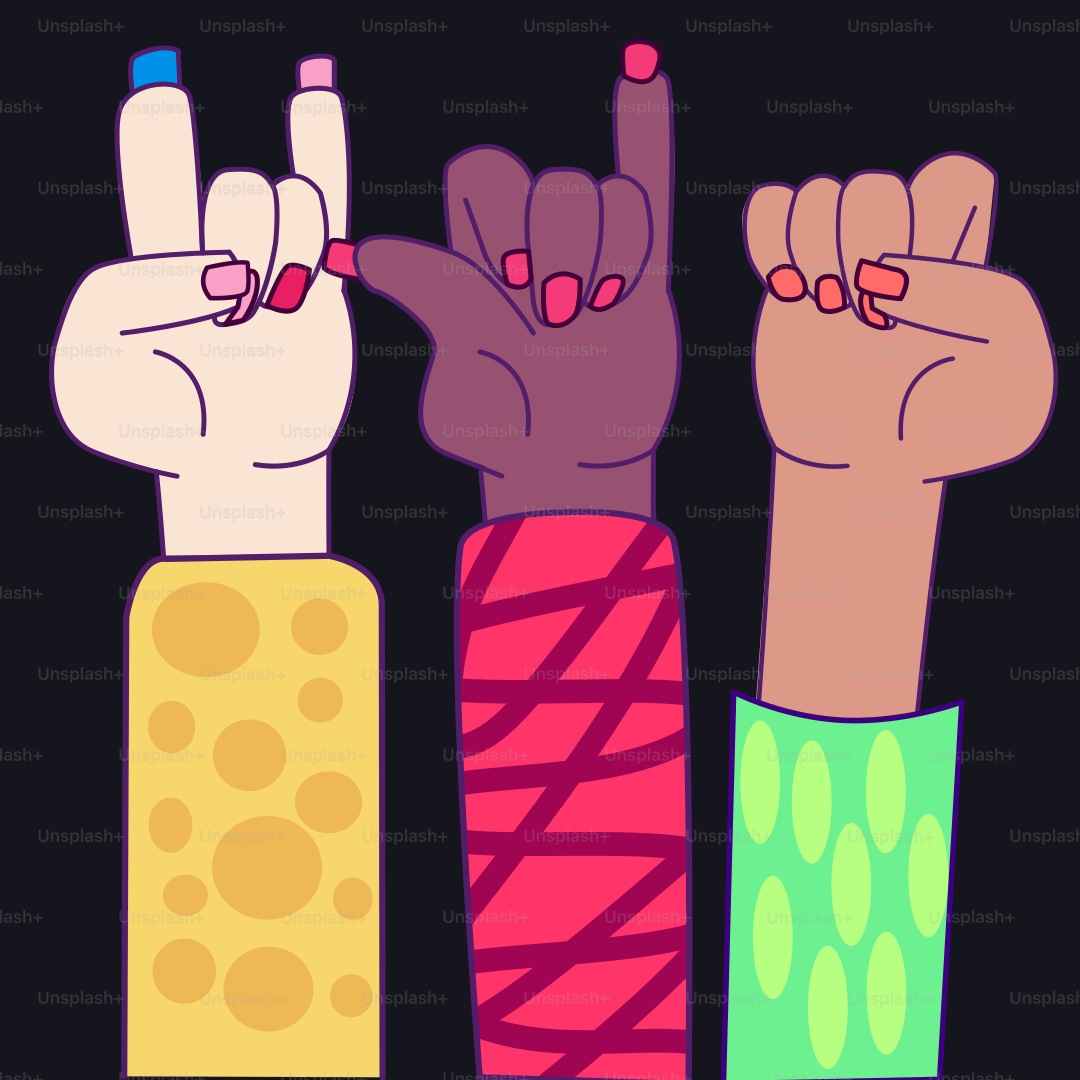 A group of people raising their hands in the air