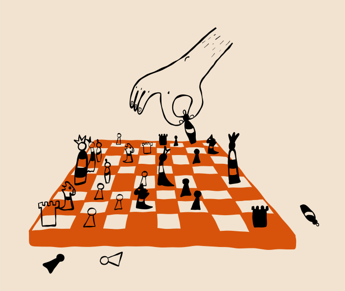 A hand places a chess piece on the board.