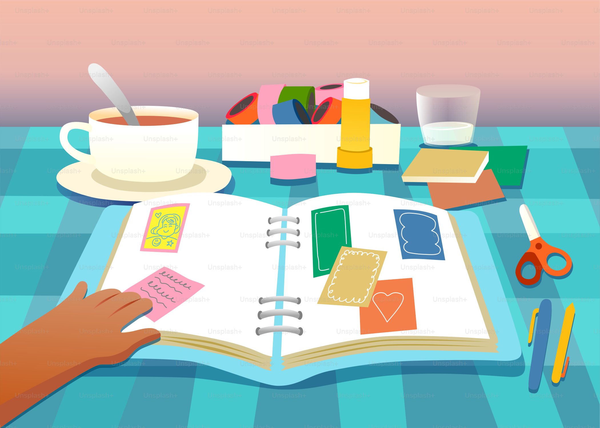 Scrapbooking-Szene mit Tee und Bastelbedarf auf einem Tisch.