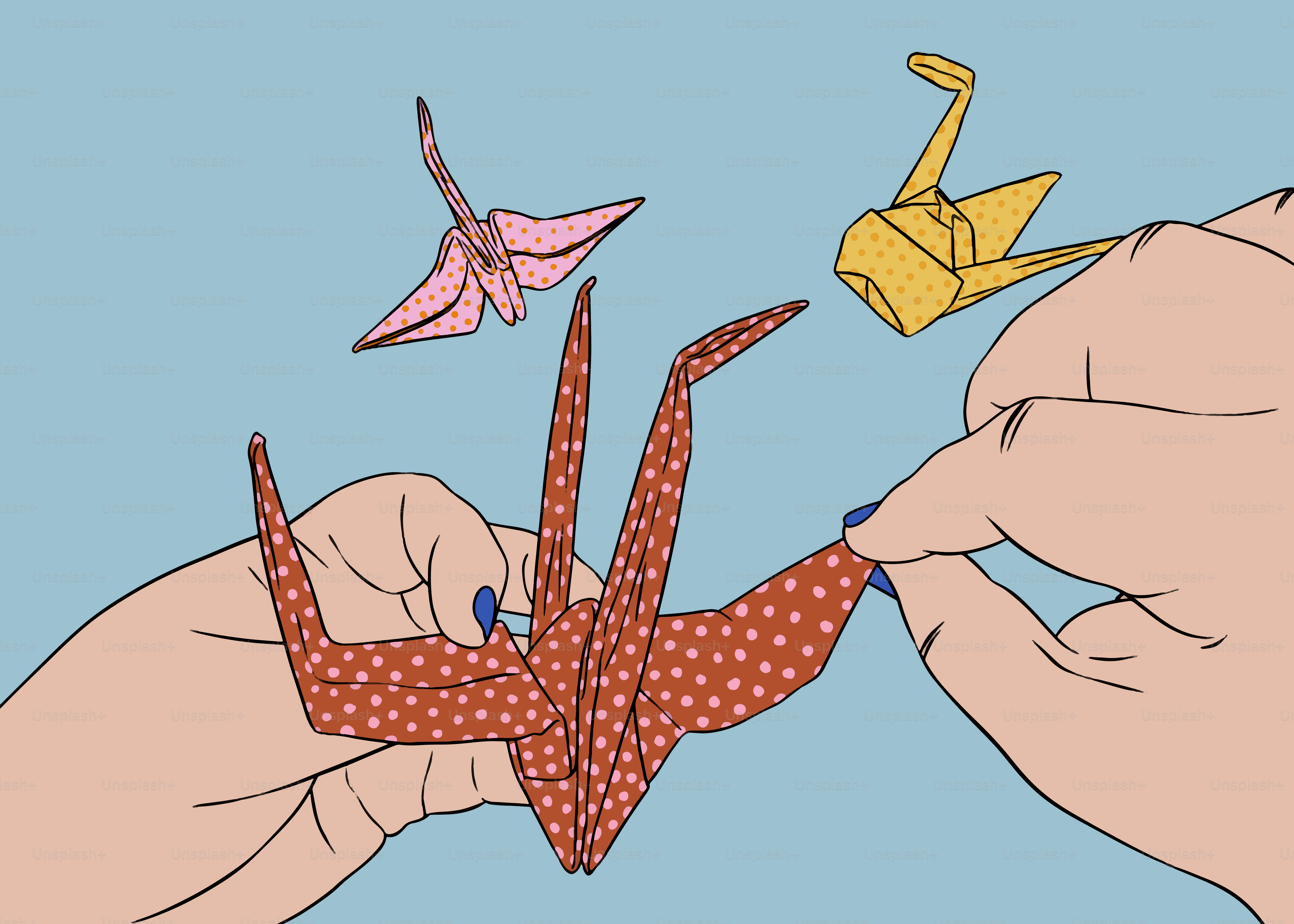 Hands carefully folding colorful origami cranes.