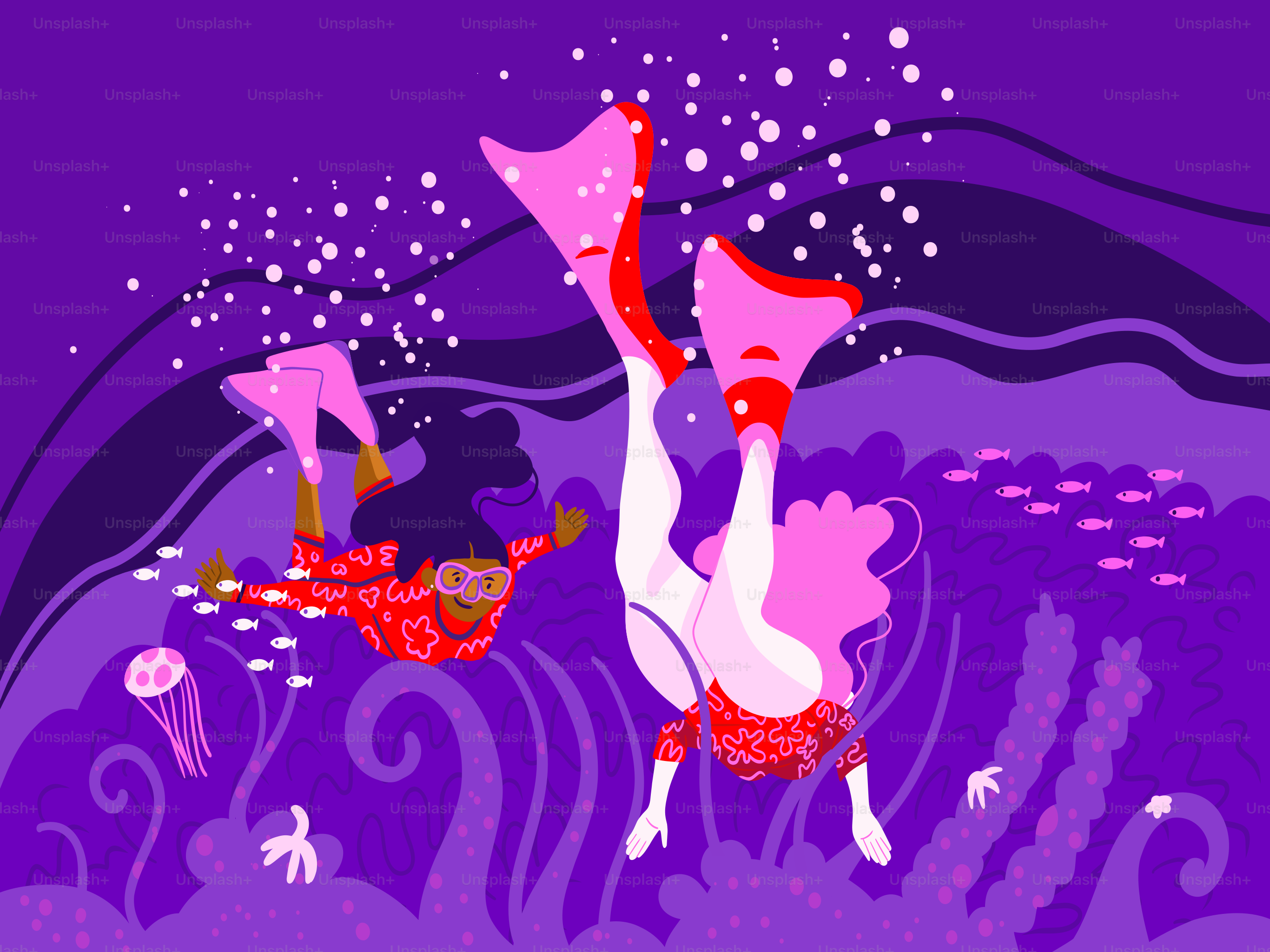 Two divers explore the ocean's depths.