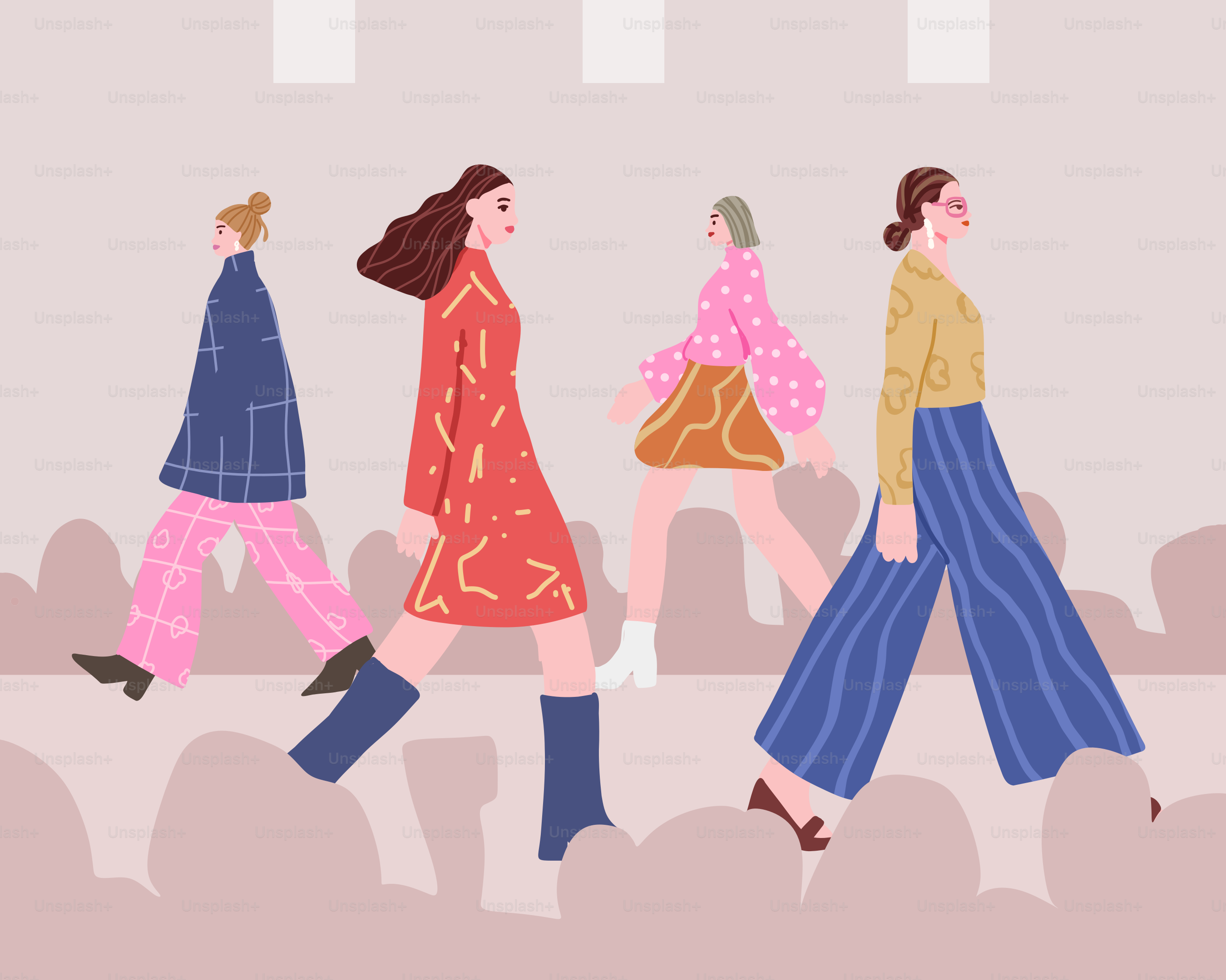 Donne alla moda che sfilano in passerella.