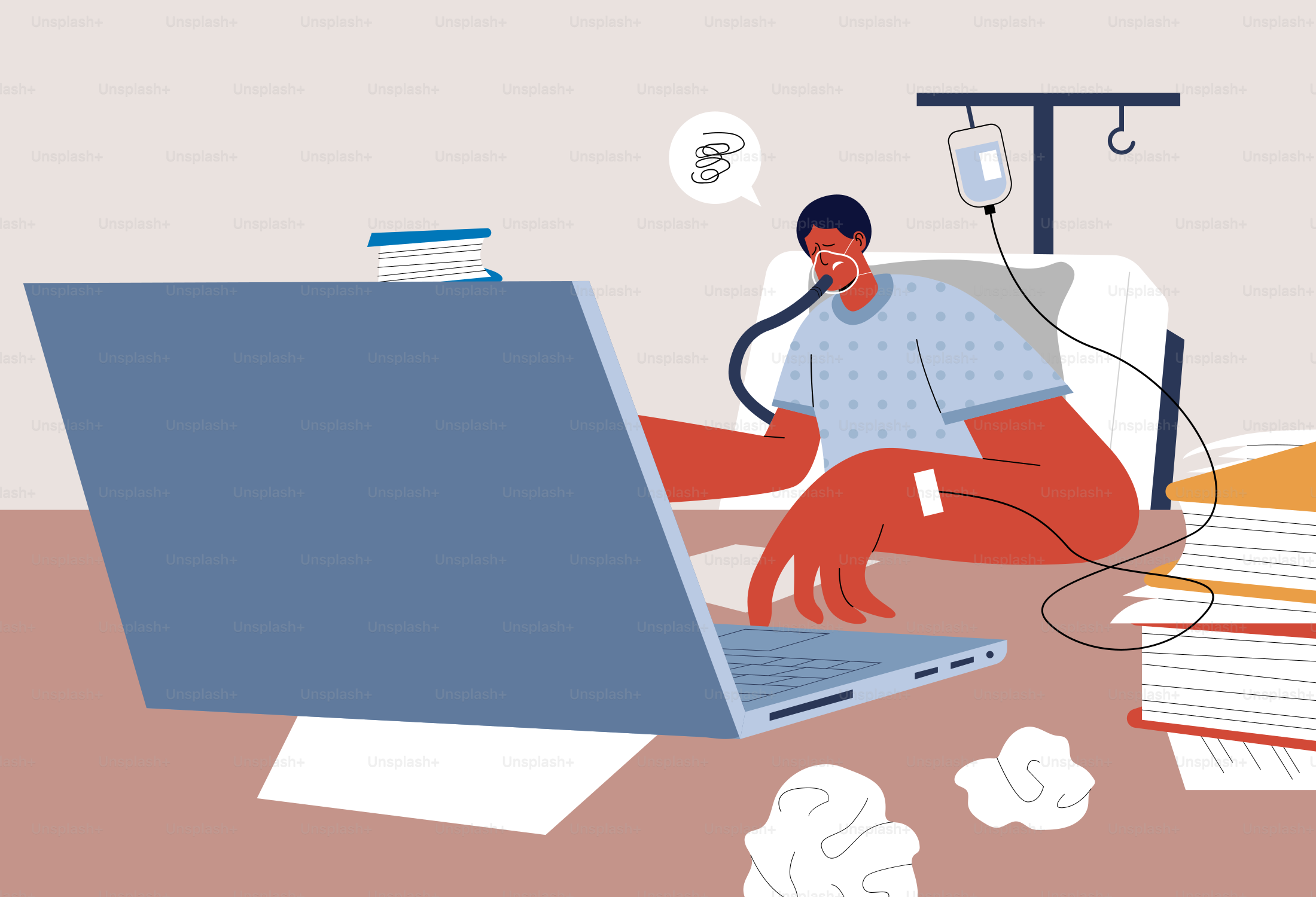 Man works in bed while connected to an iv.