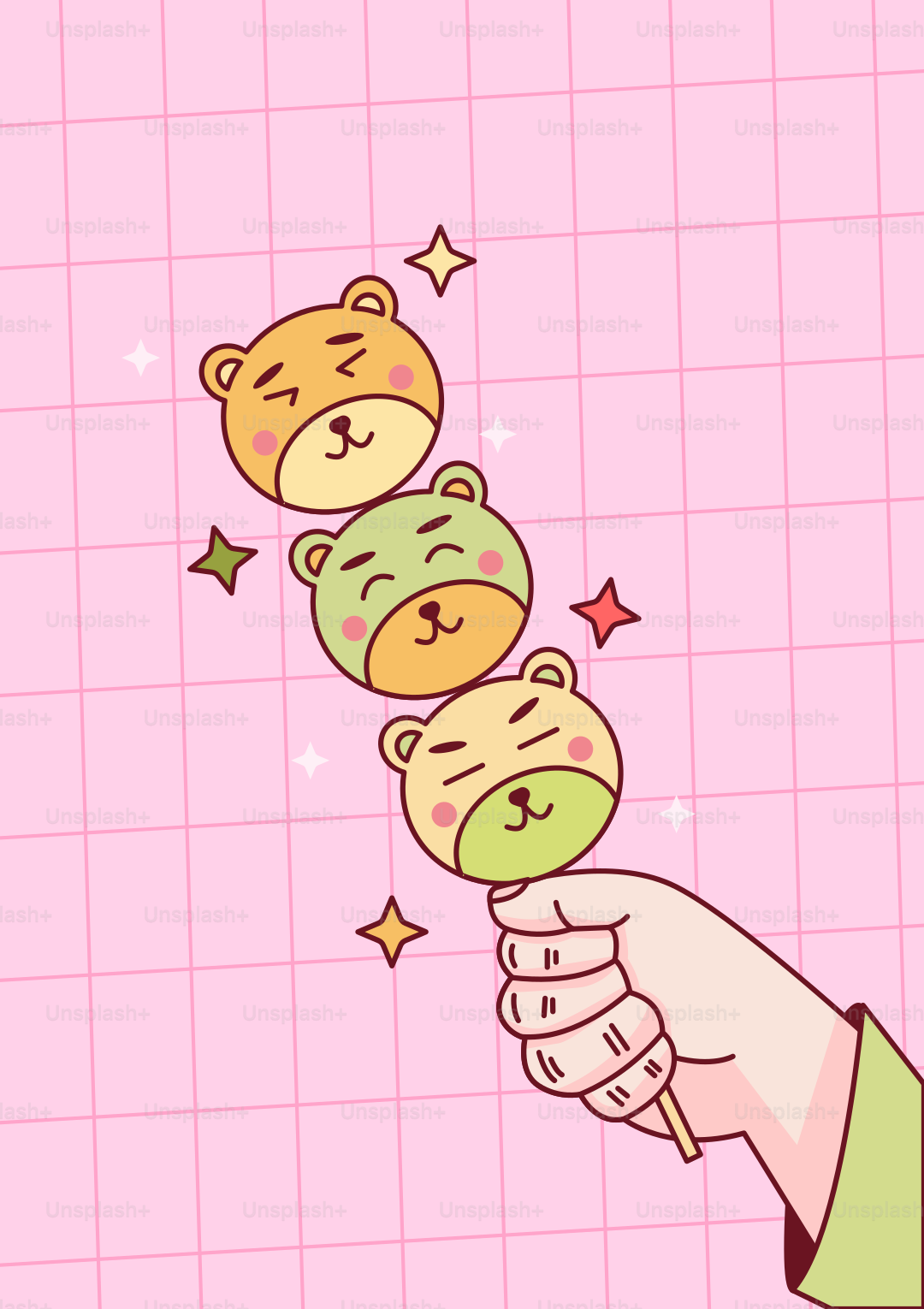A hand holds adorable bear-shaped treats.