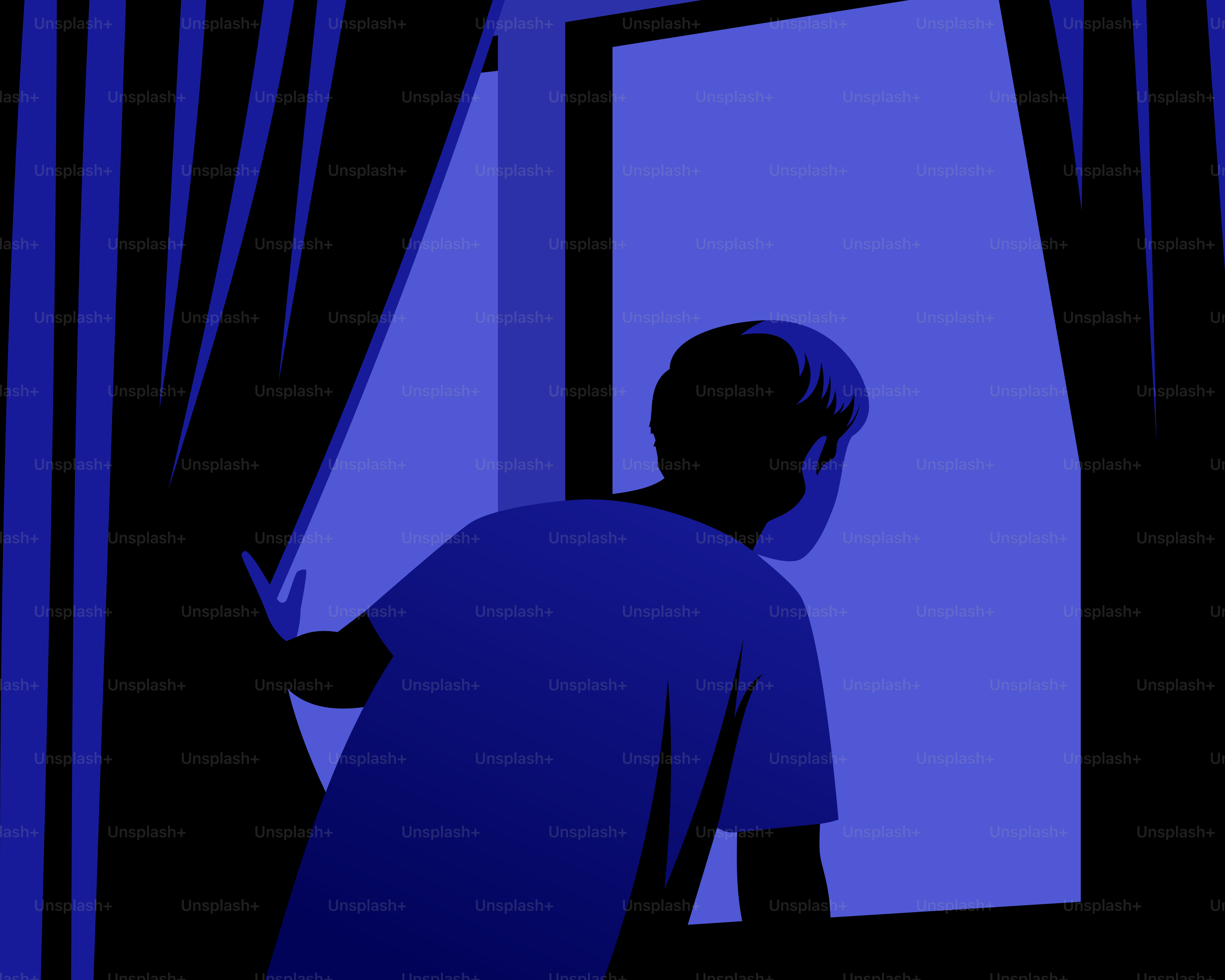 A person looks out of a window at night.