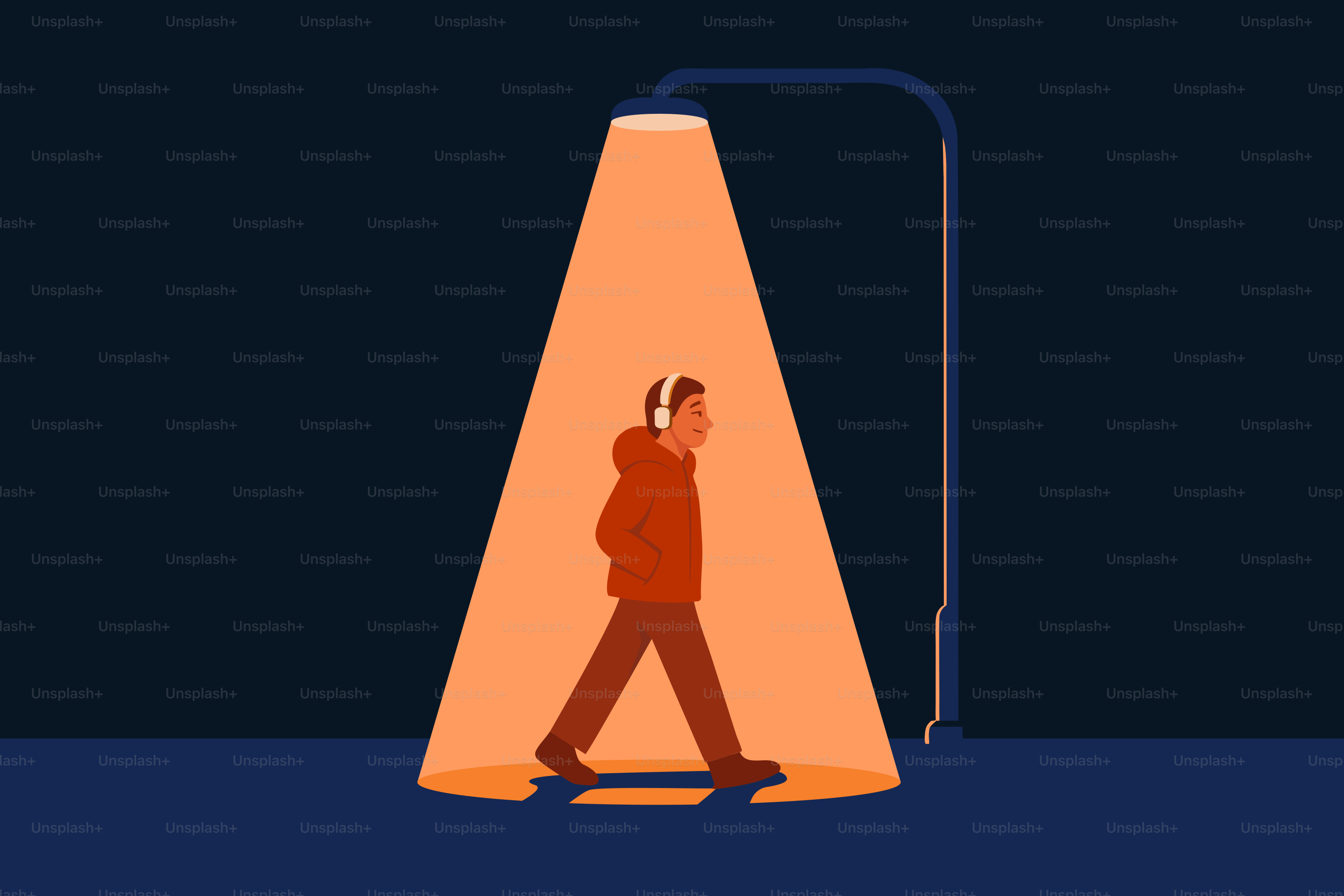 A person walks under a street light at night.