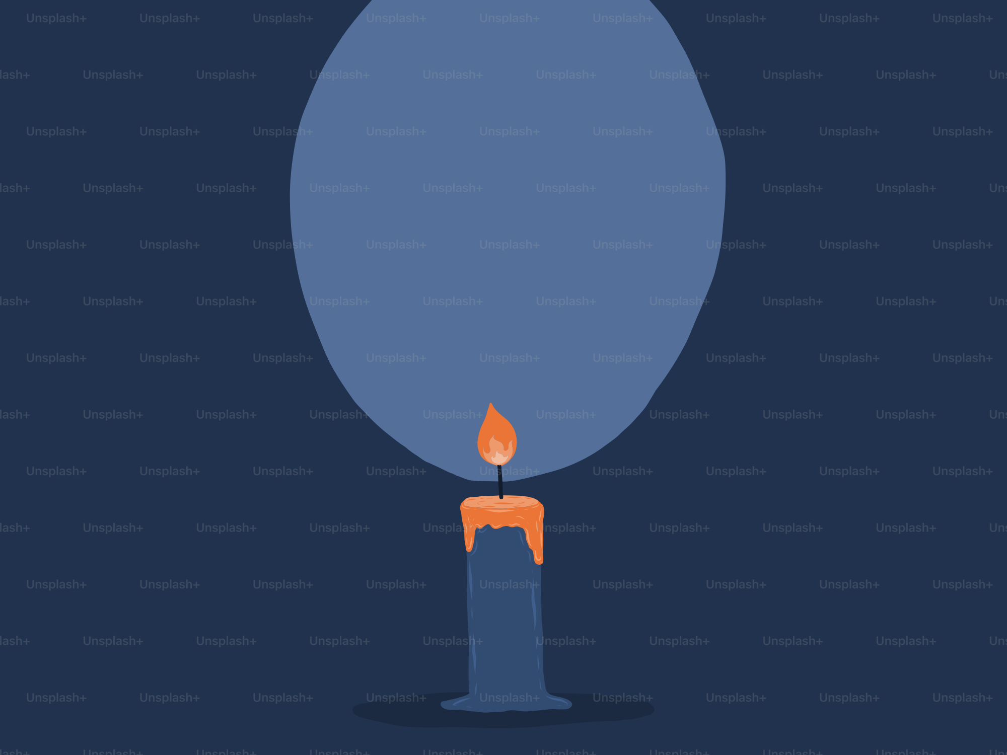 A lit candle shines in the dark.