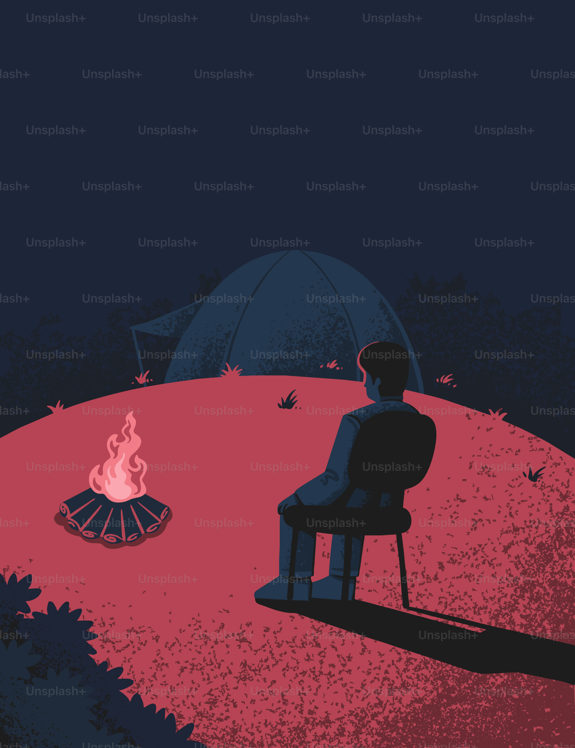 A man sits by a campfire at night.
