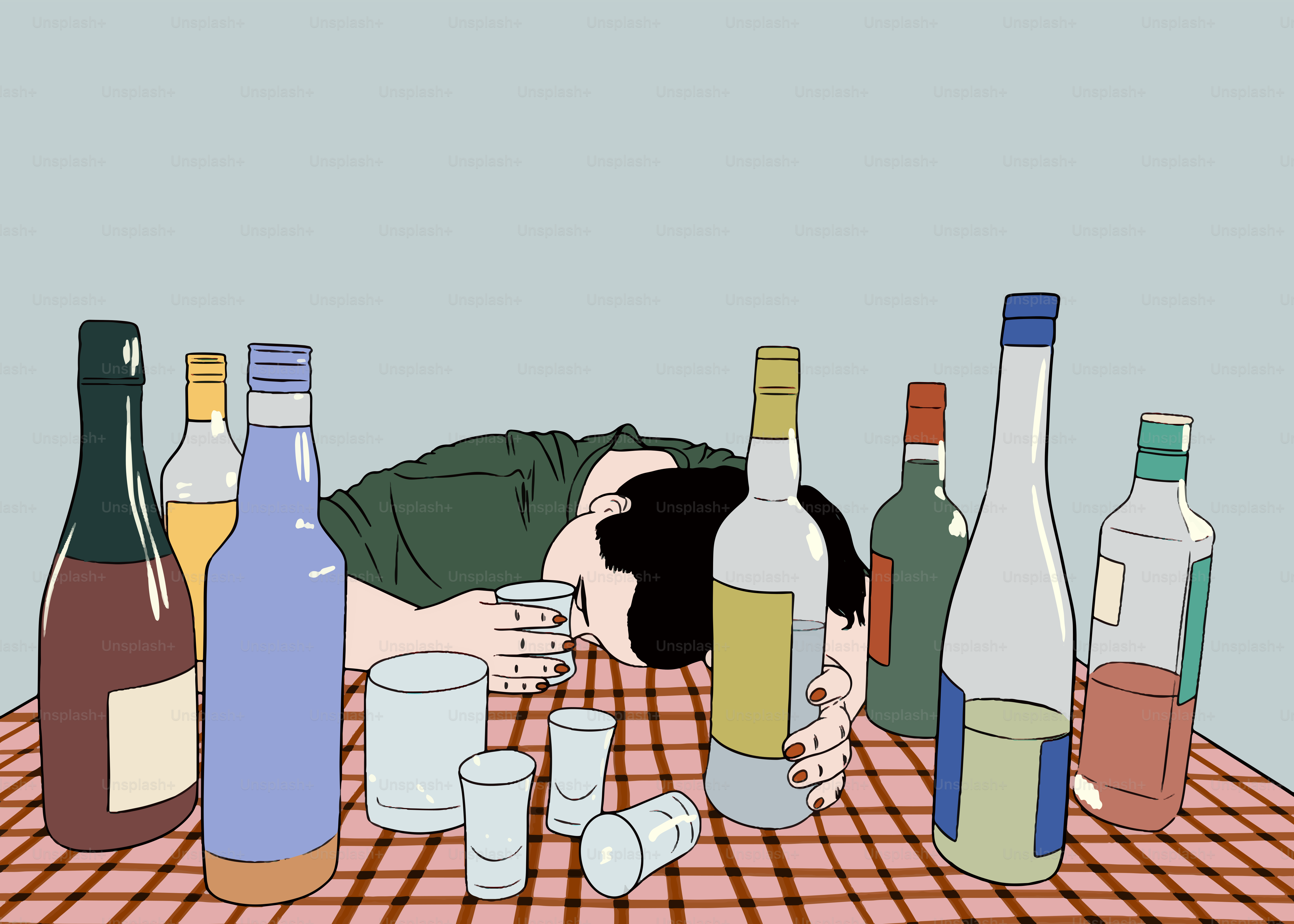 Alguien está desmayado rodeado de alcohol.