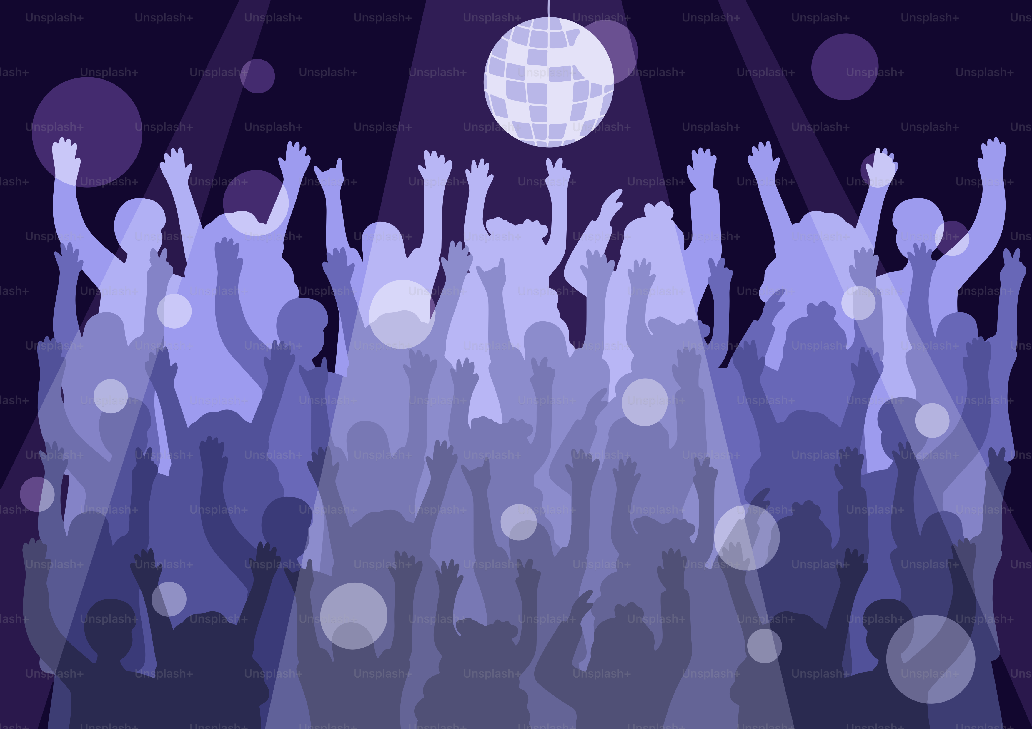 People are dancing under a disco ball at a party.