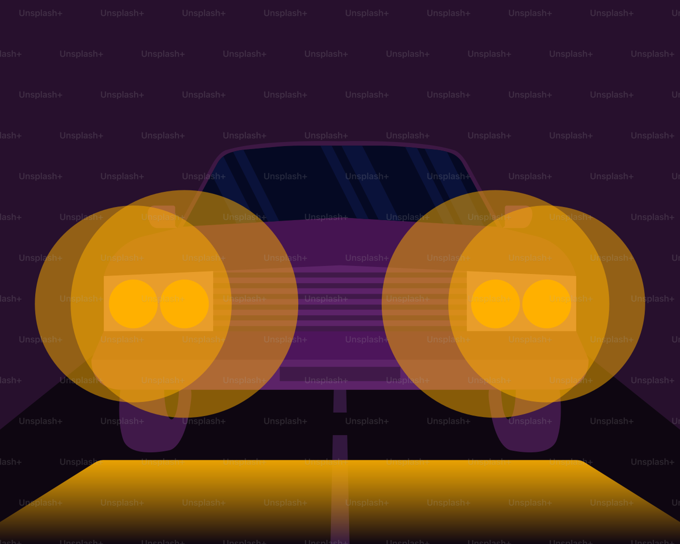 Les phares d’une voiture éclairent une route sombre.