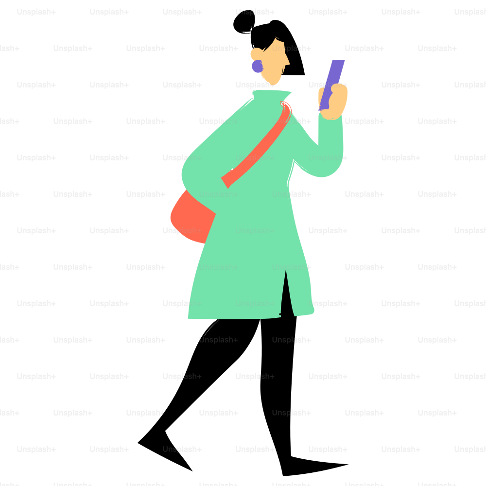 A woman walks while looking at her phone.