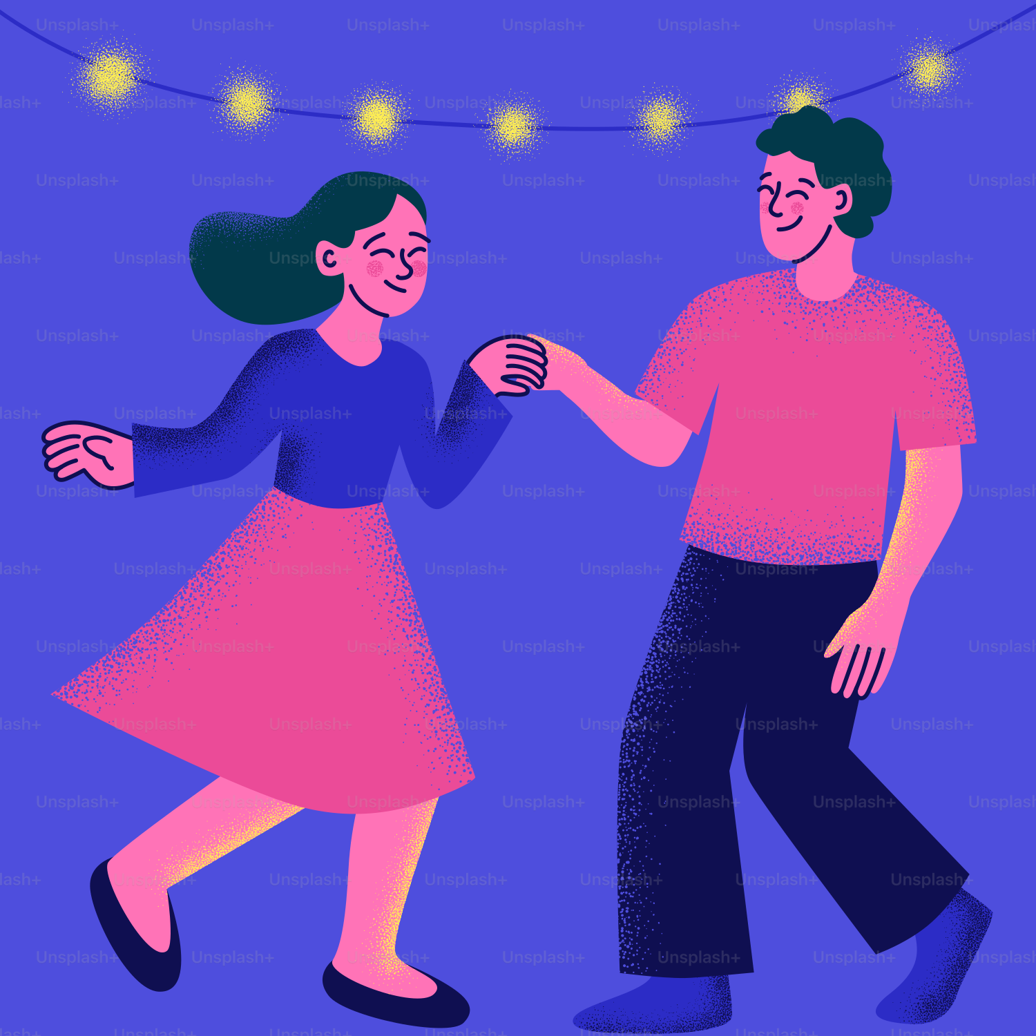 A couple dances happily together under string lights.