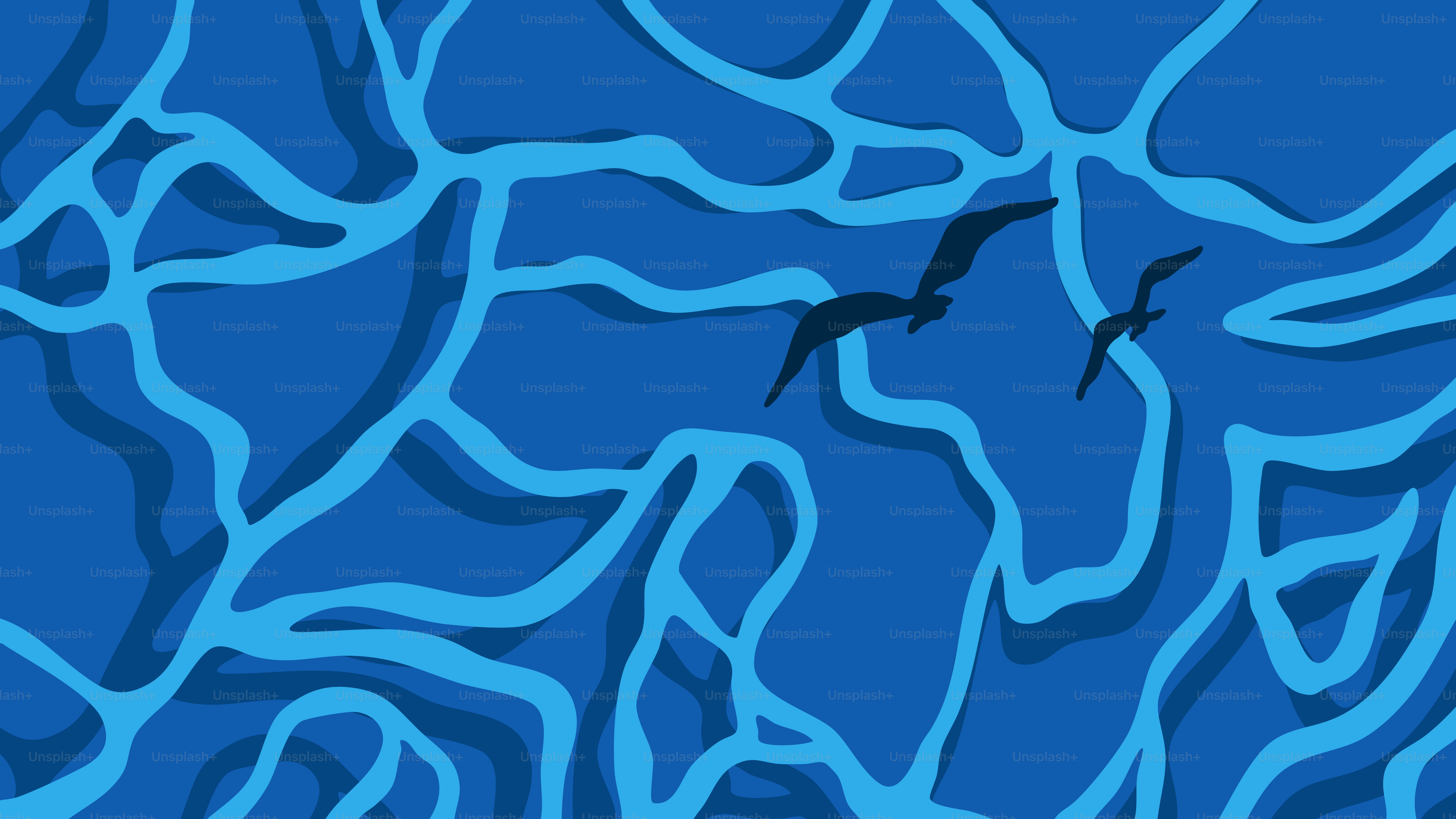 Two birds fly over blue water.