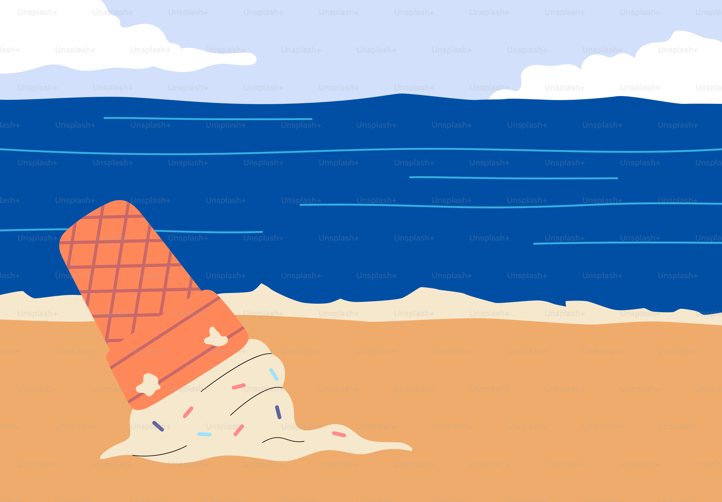 An ice cream cone lies on the beach.