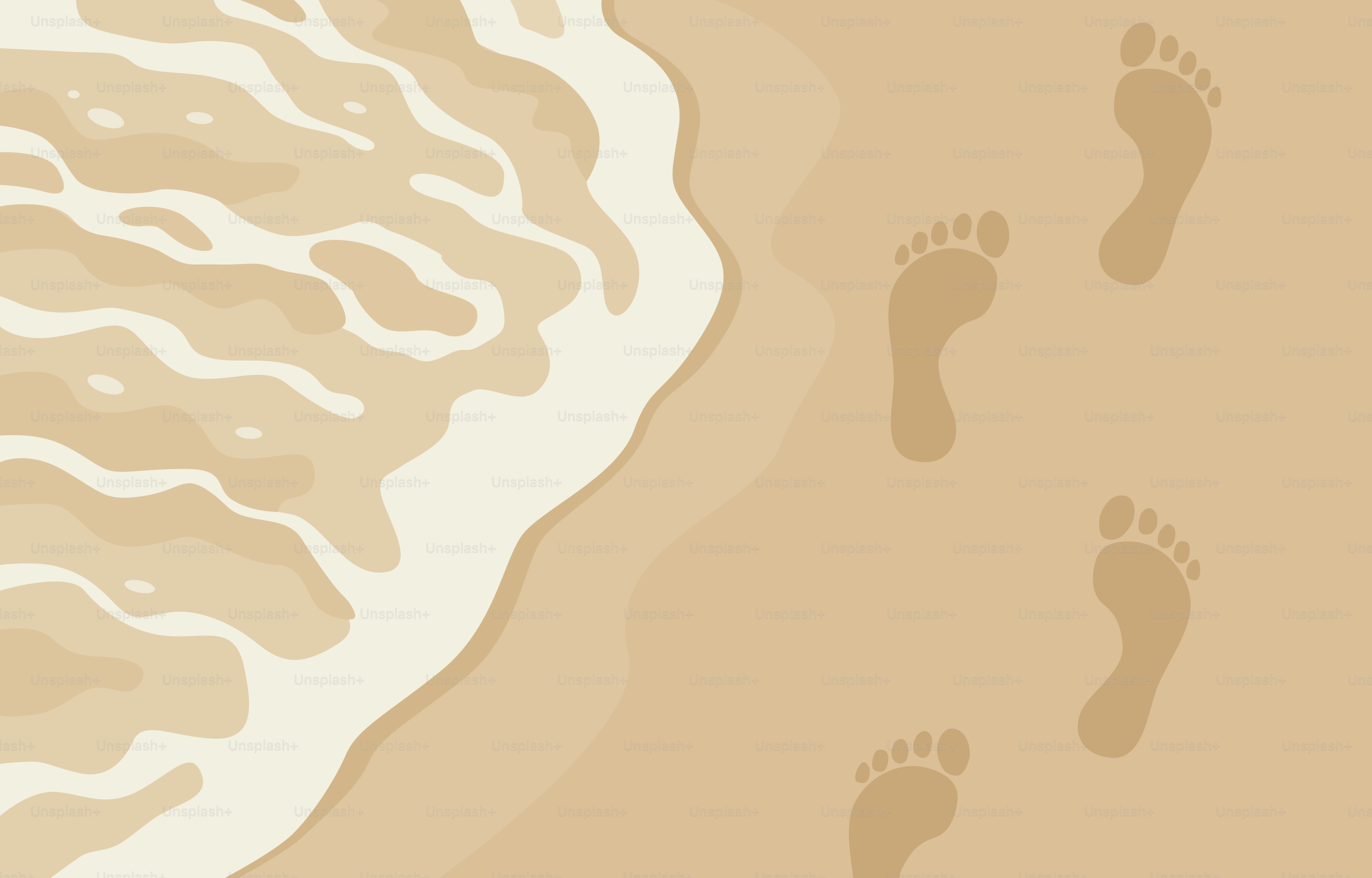 Footprints on the sand near the ocean waves.