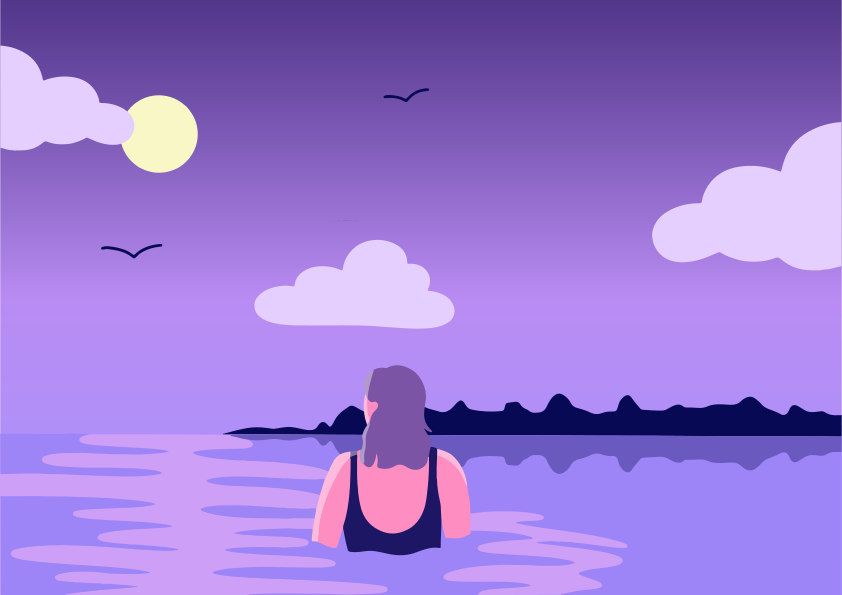 A woman enjoys a swim at dusk.