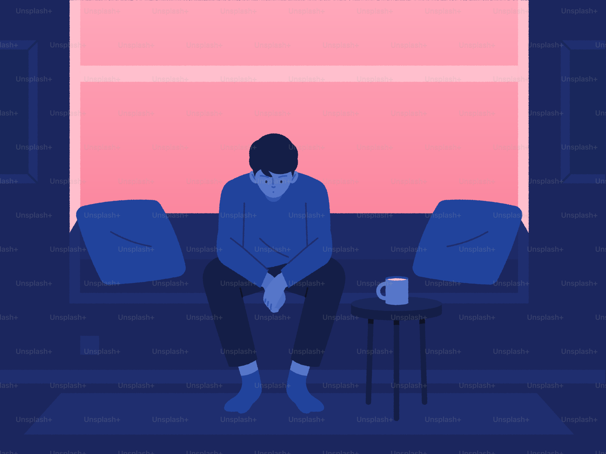 Une personne a l’air abattue, assise à l’intérieur.