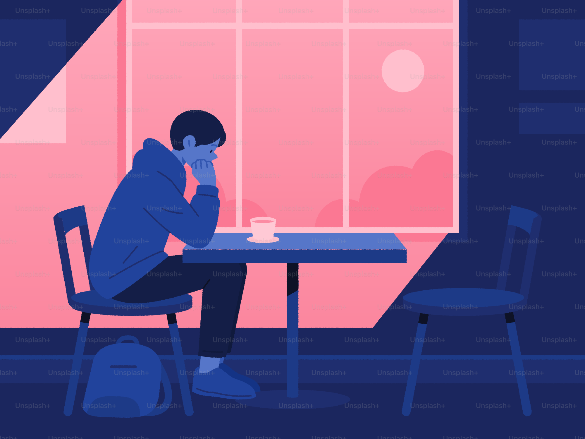 A person sits alone at a table.
