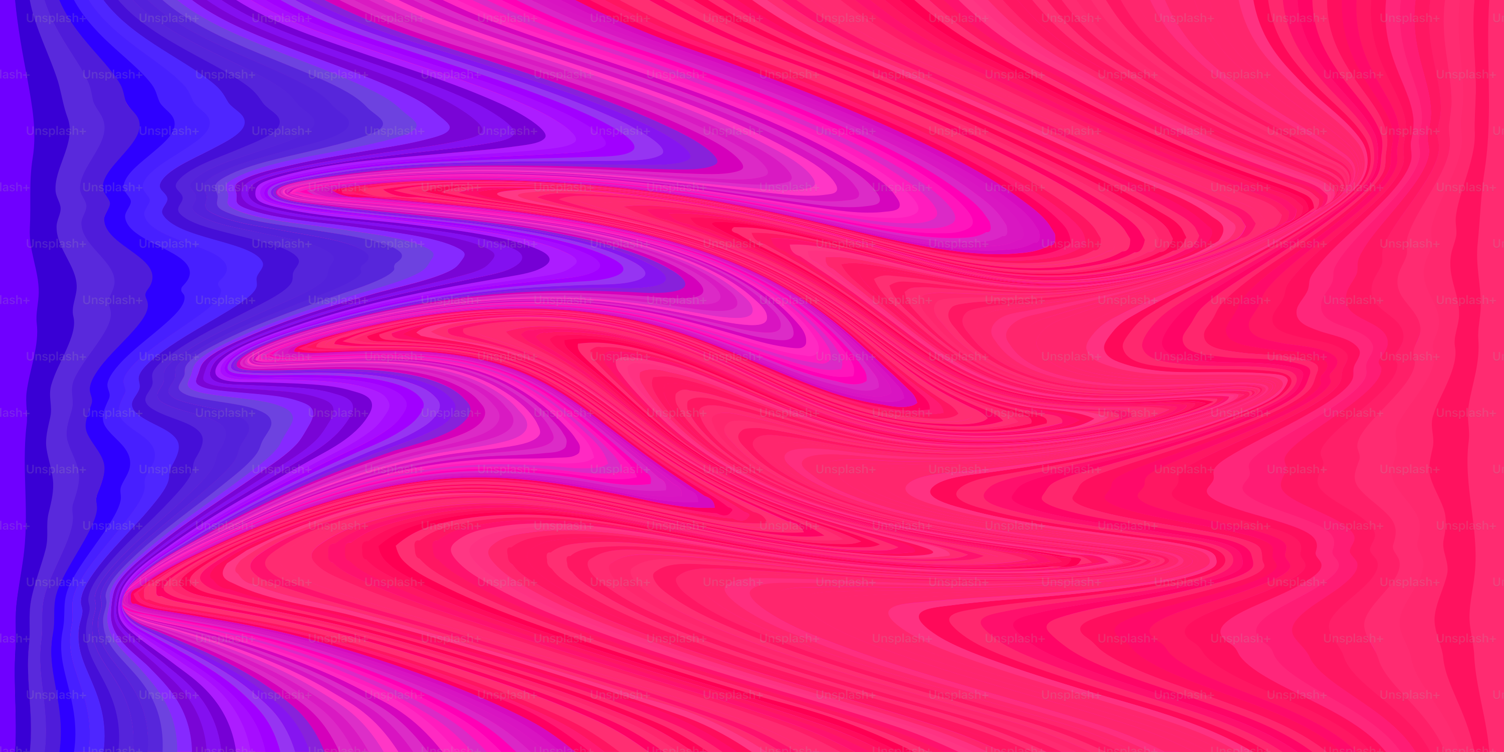 Abstract, swirled colors of blue, pink, and red.