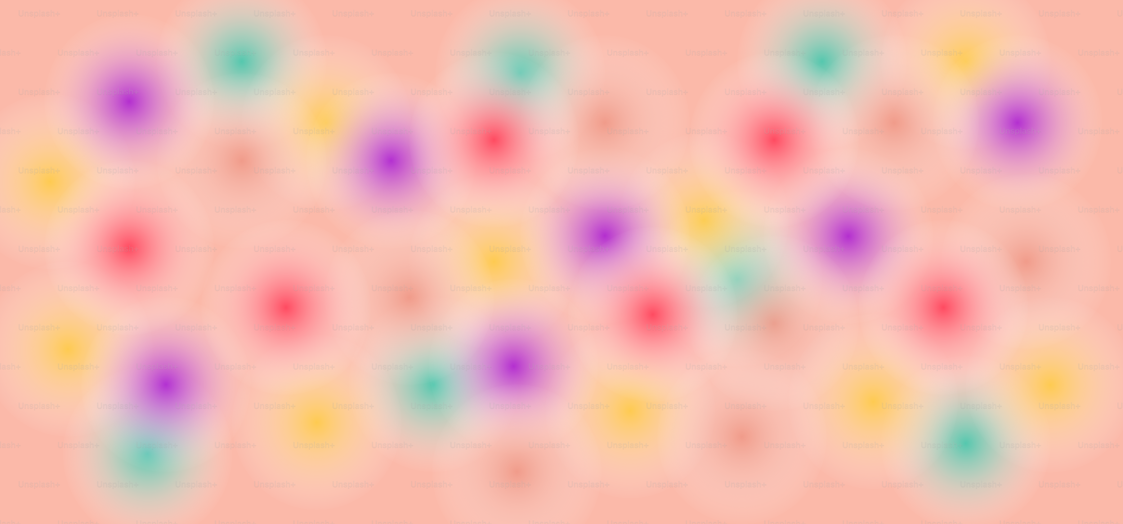 Cerchi colorati sfocati su uno sfondo pesca.