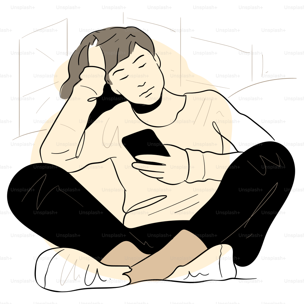 A person sits, looking at their phone.