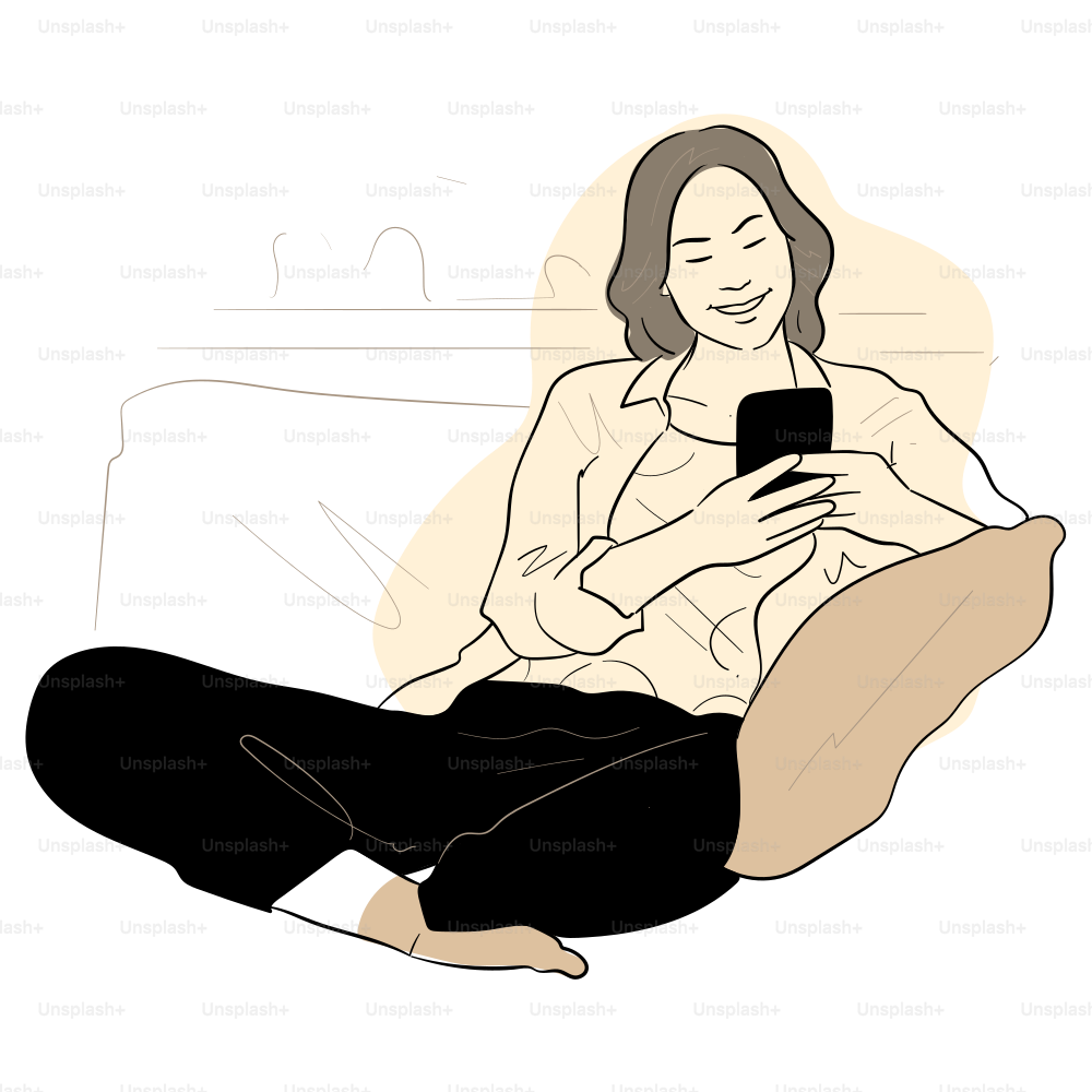 A woman is smiling while looking at her phone.