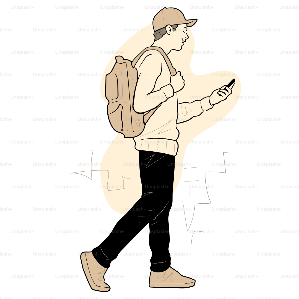 A man walks while looking at his phone.