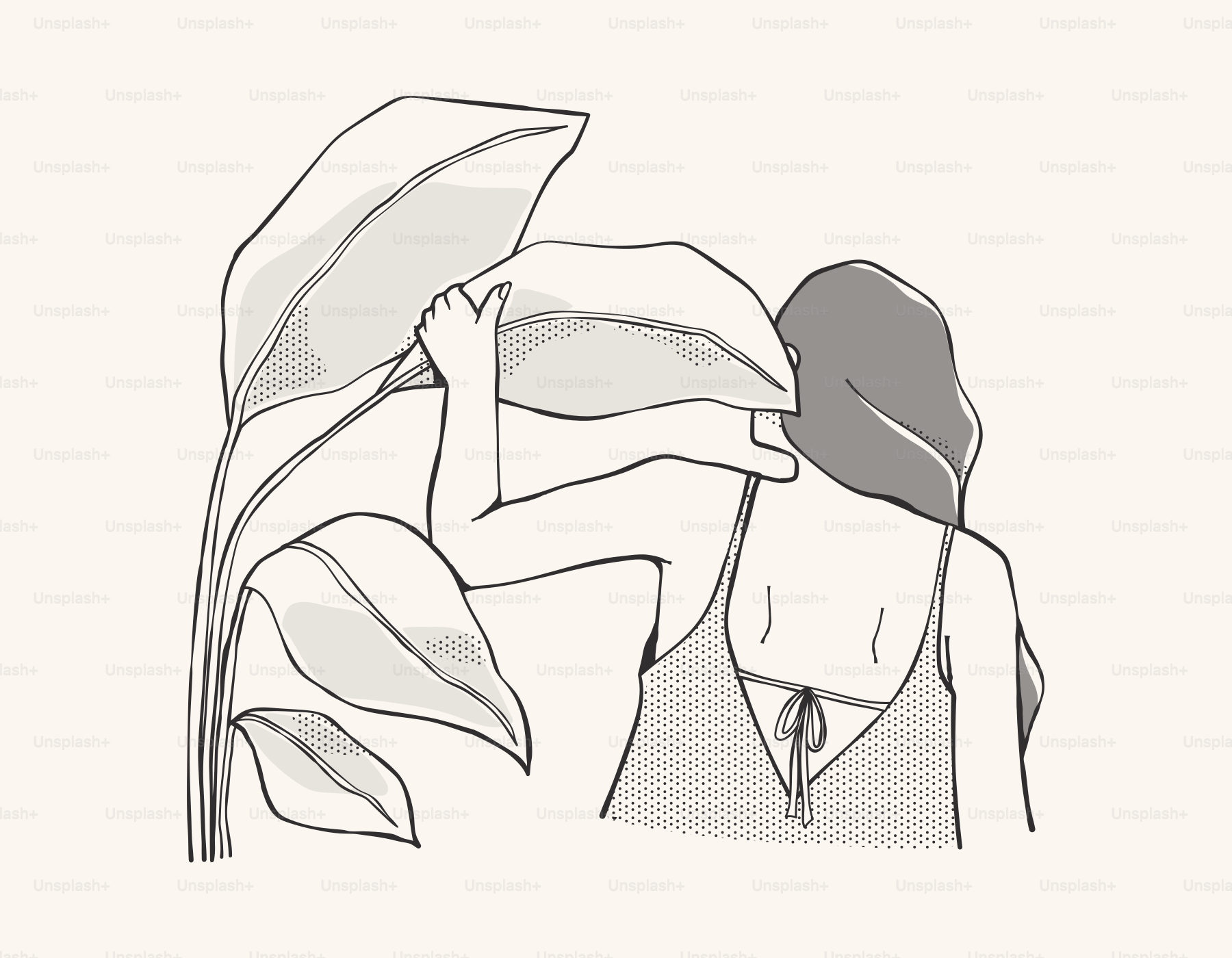 A woman gently holds a large leaf.