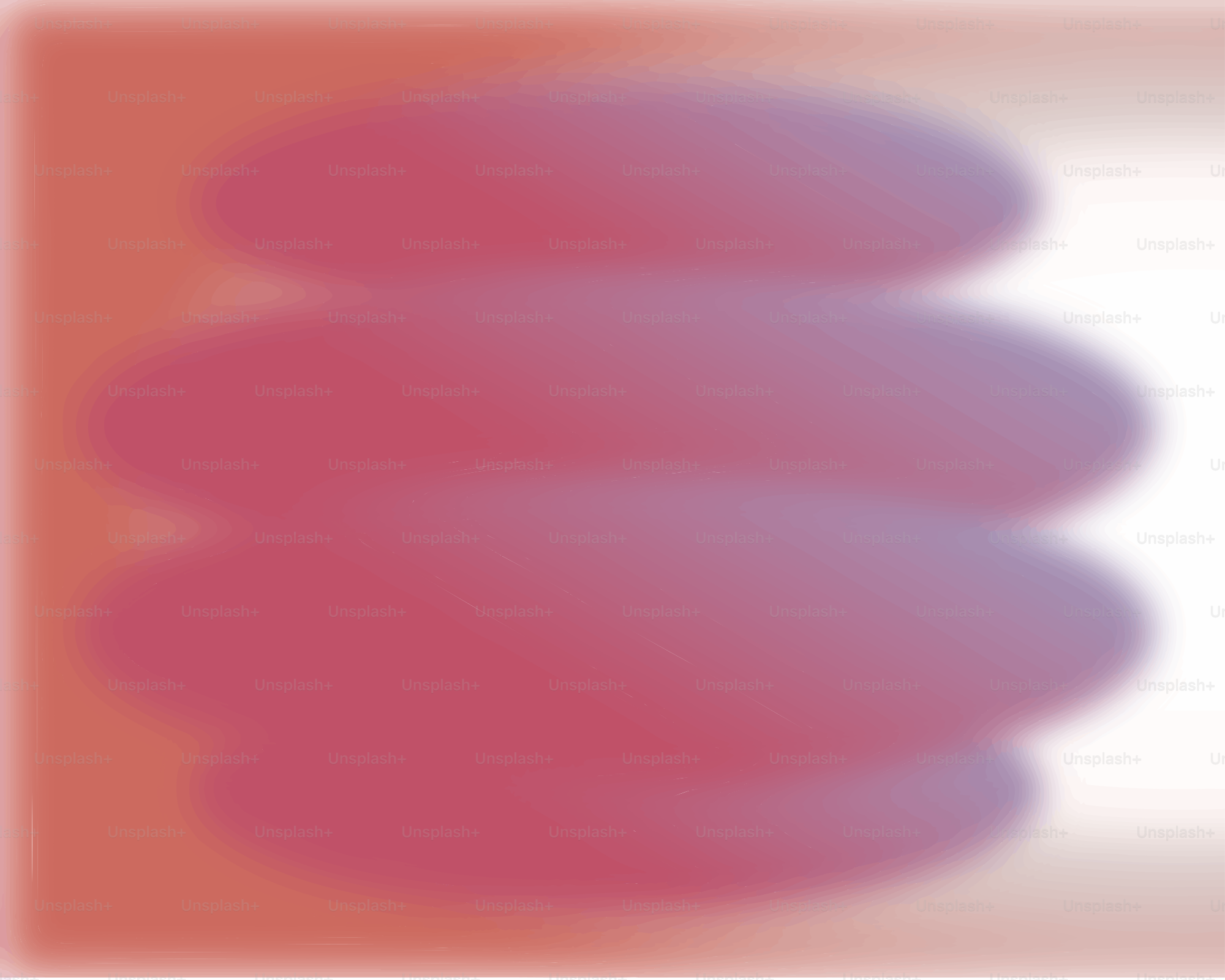 Blurred, stacked ovals in shades of pink and purple.