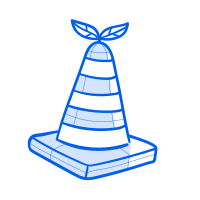 A traffic cone with leaves on top.