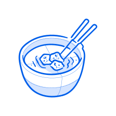 Soup with tofu and chopsticks.