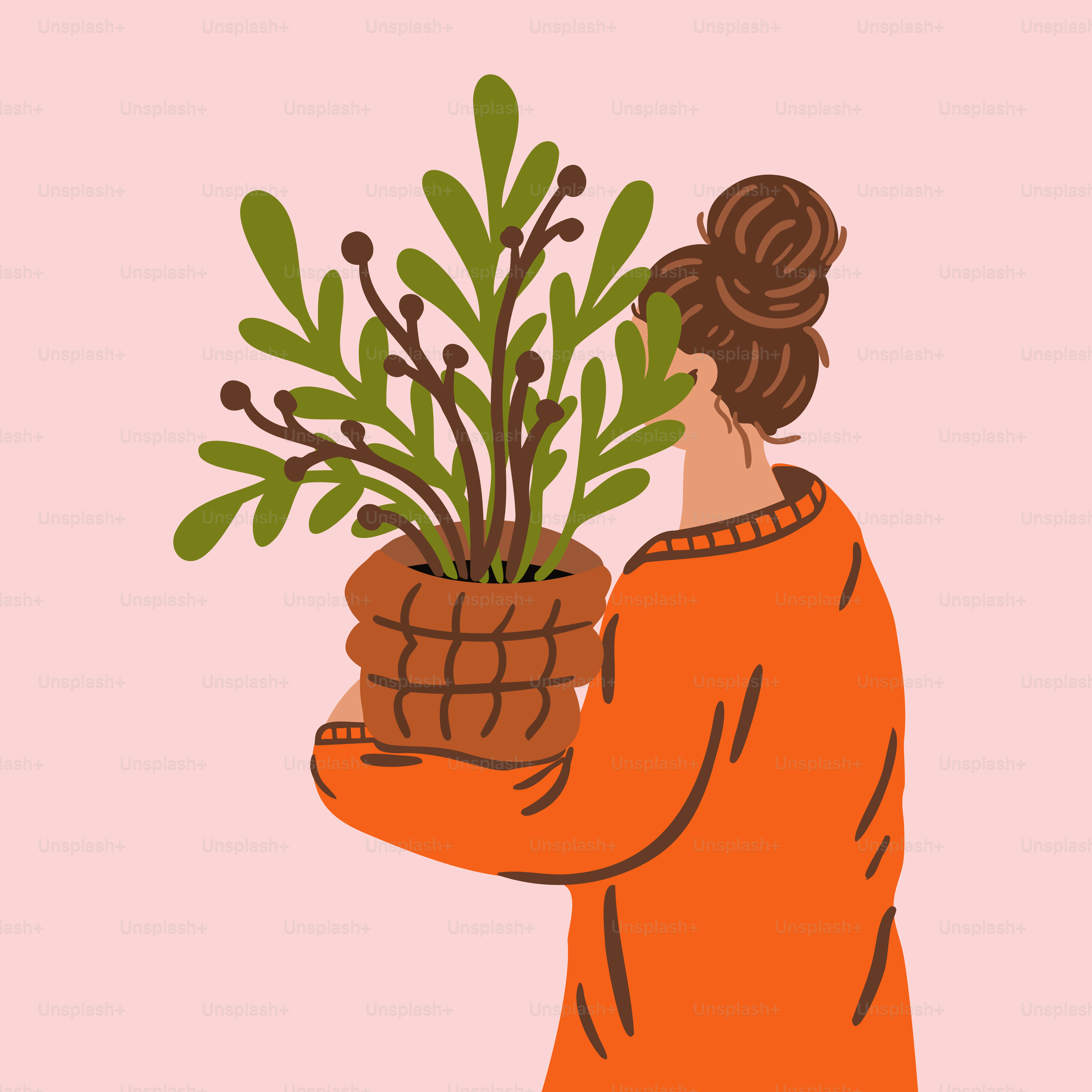 Une femme tient une plante.