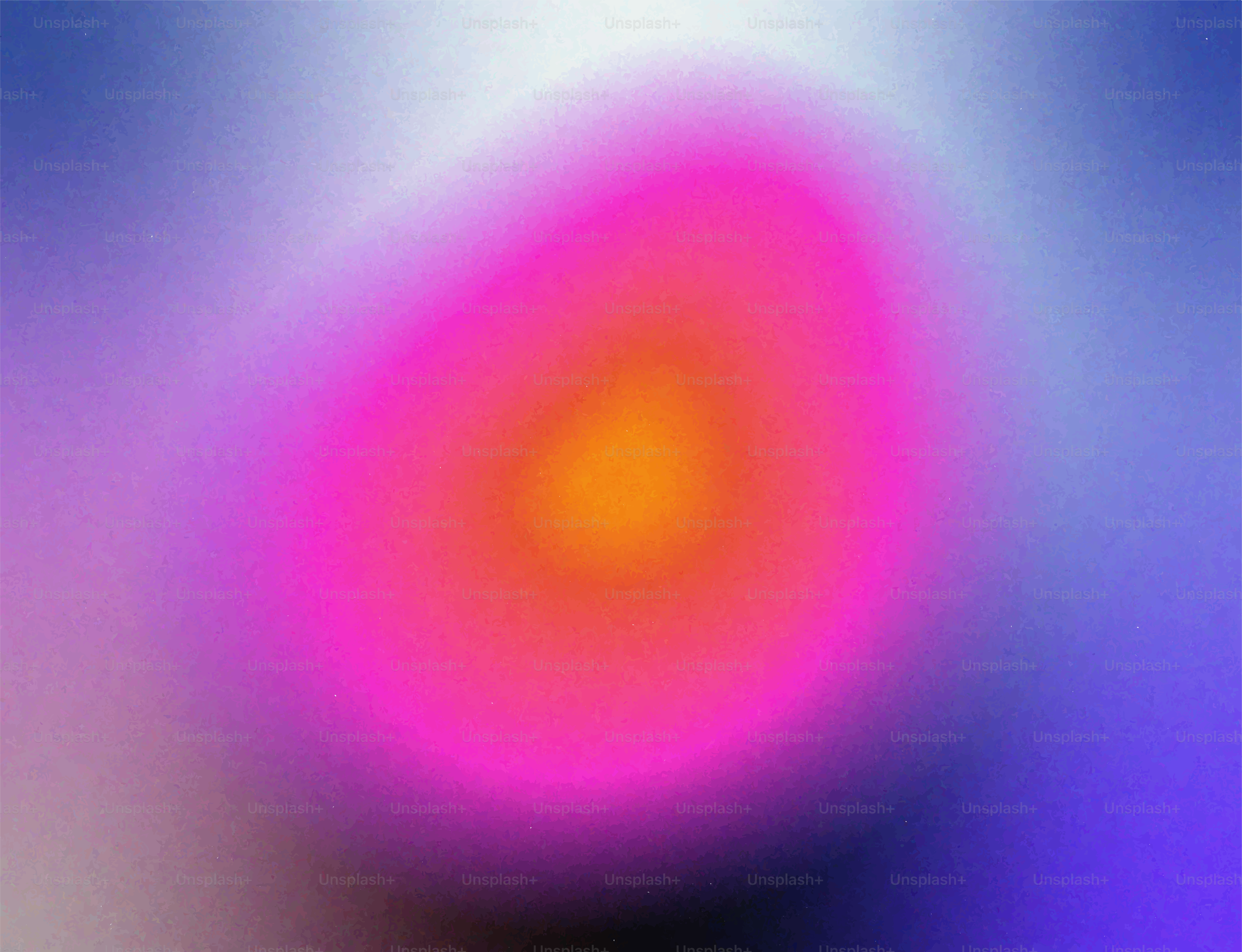 A blurry pink and orange blob against blue.